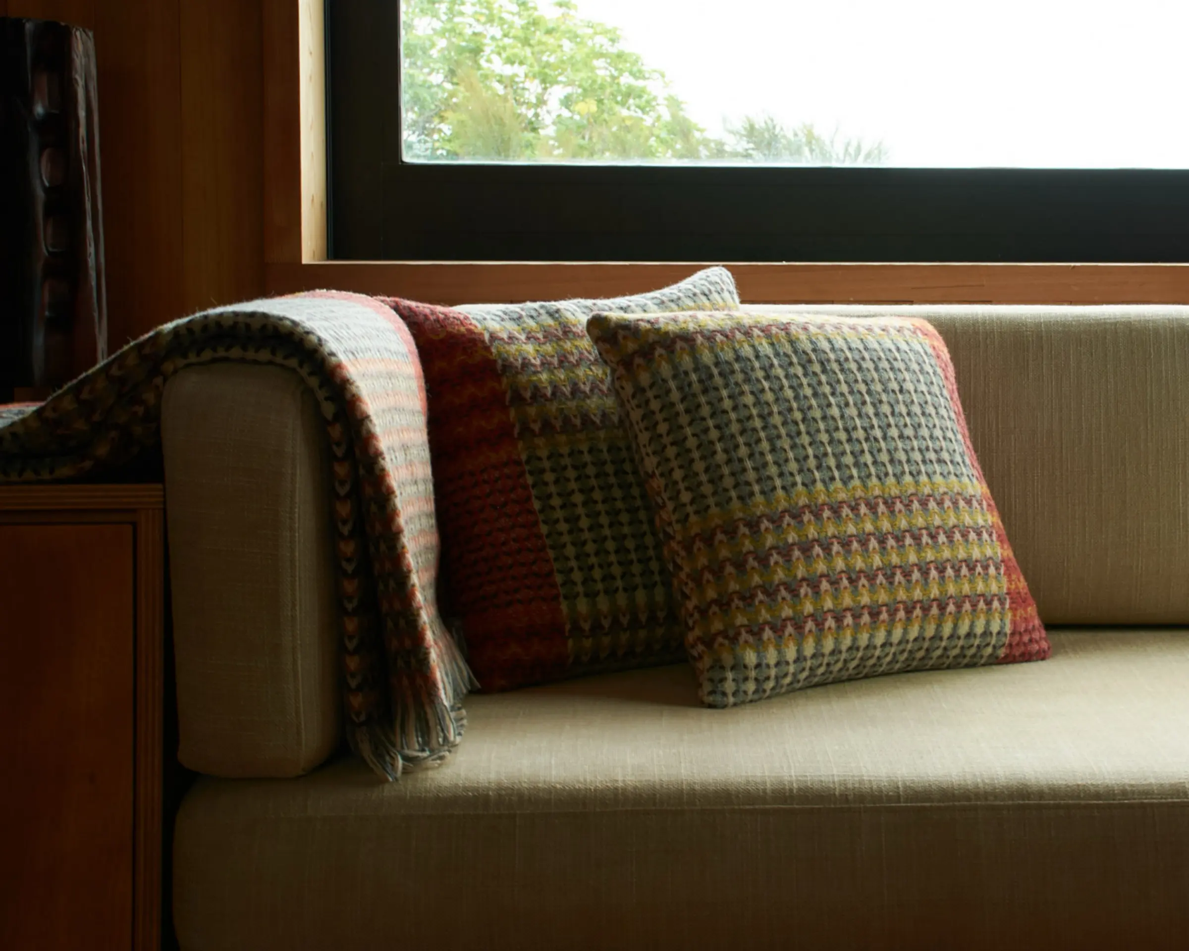 a wool cushion and throw on a side couch