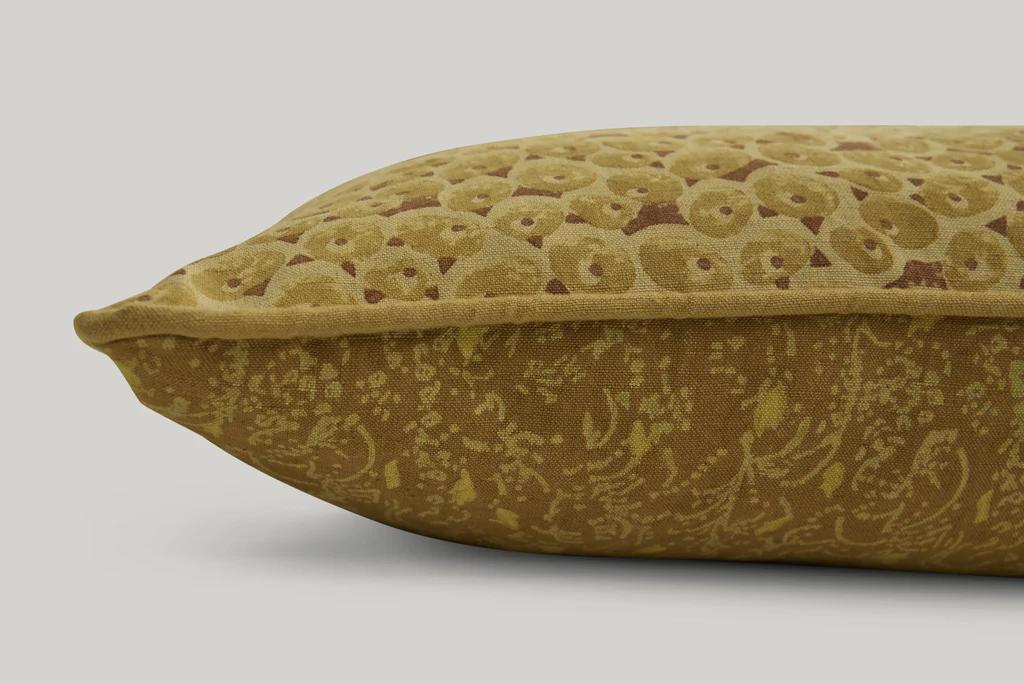 a close up of the attendant Lumbar cushion in gold mustard colour ways