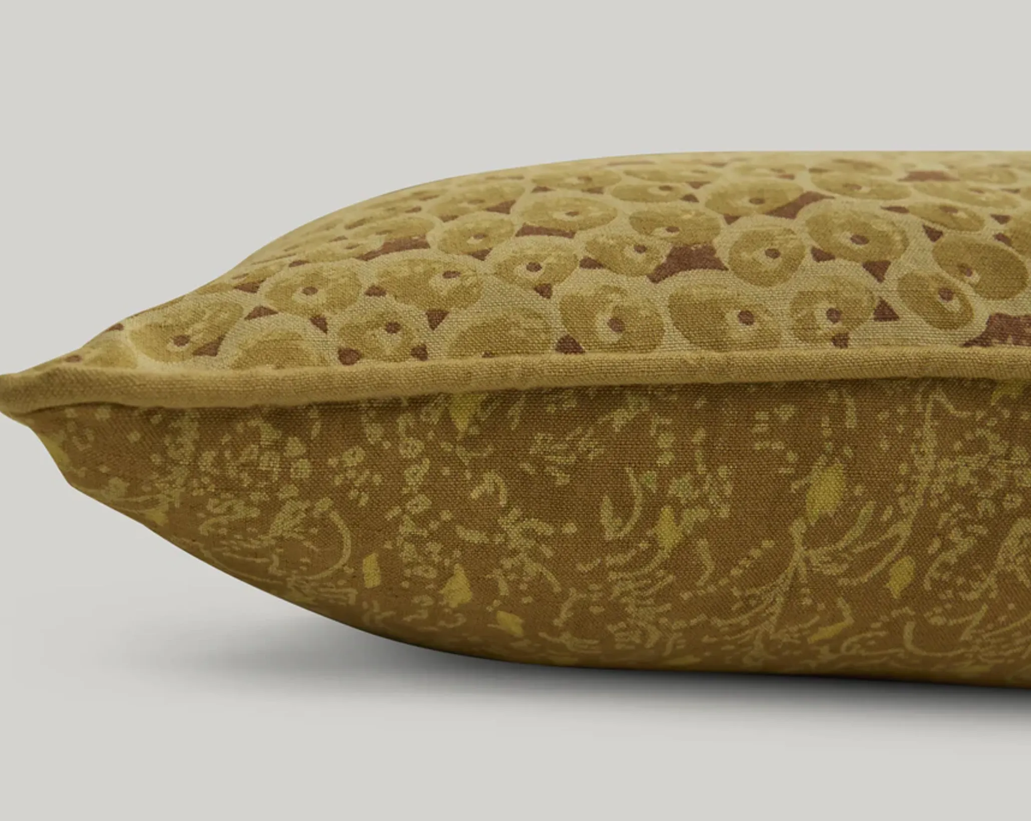 a close up of the attendant Lumbar cushion in gold mustard colour ways
