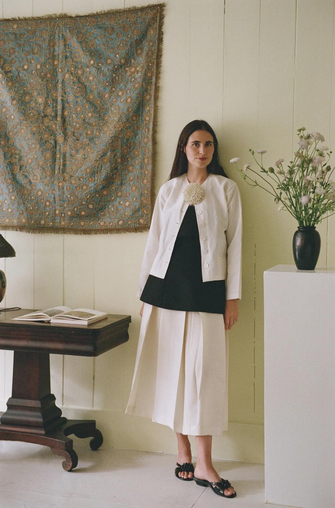 A photo of Lilli Elias standing in her new studio in New York 