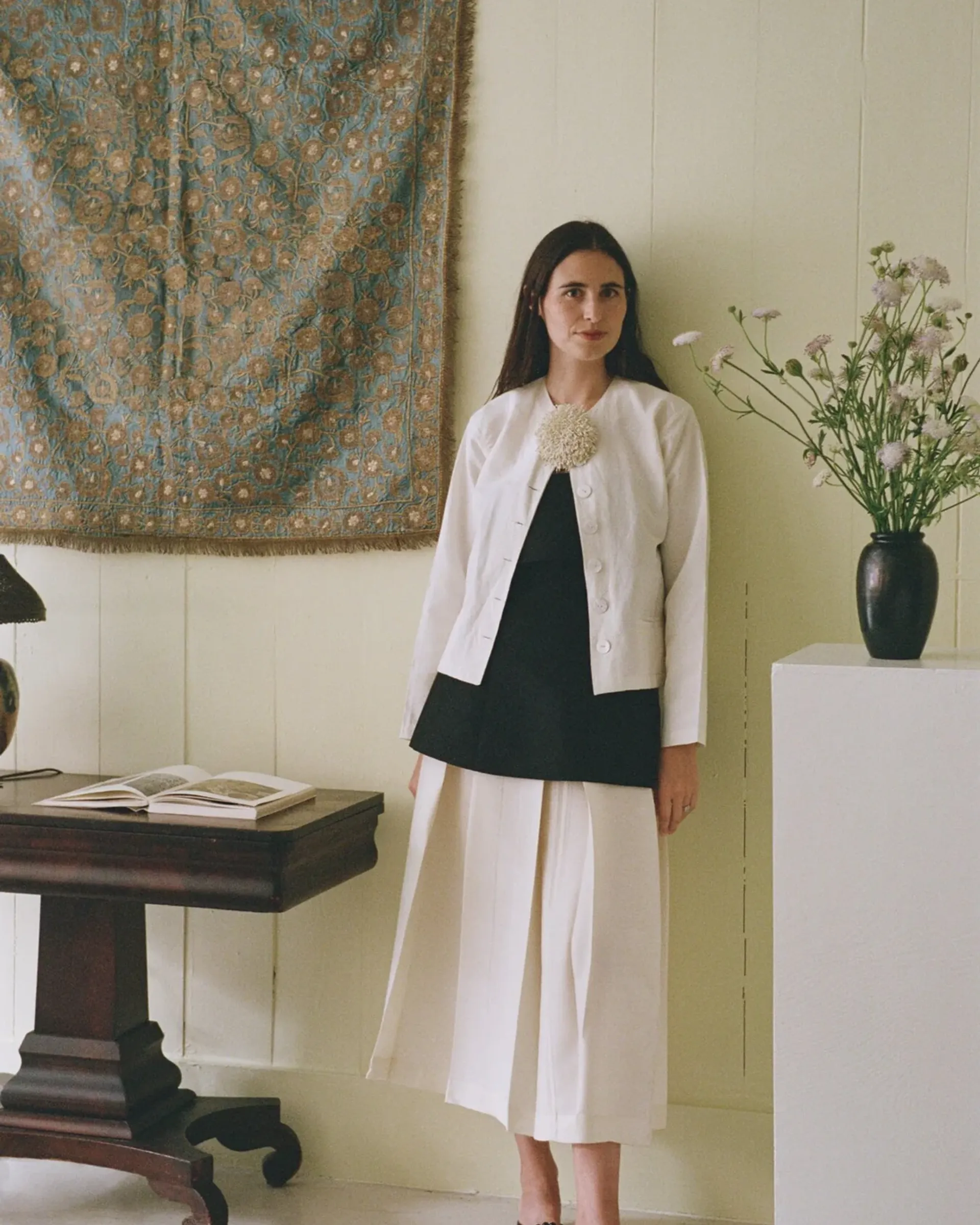 A photo of Lilli Elias standing in her new studio in New York