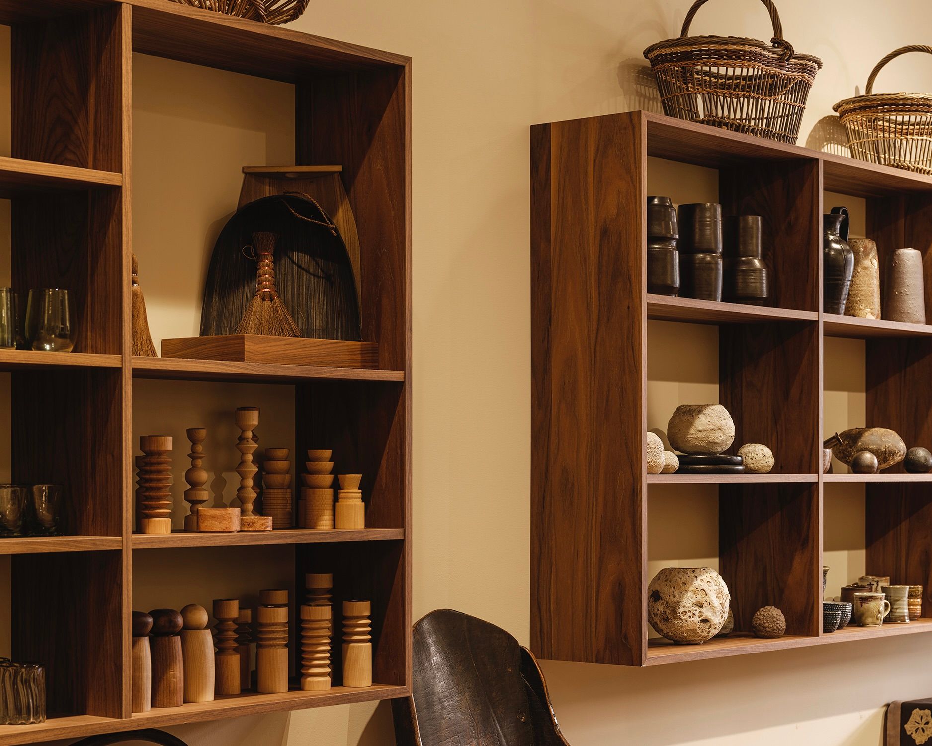 in situ photograph of Handcrafted Modern display shelves featuring ceramic vases, wooden candlesticks and baskets