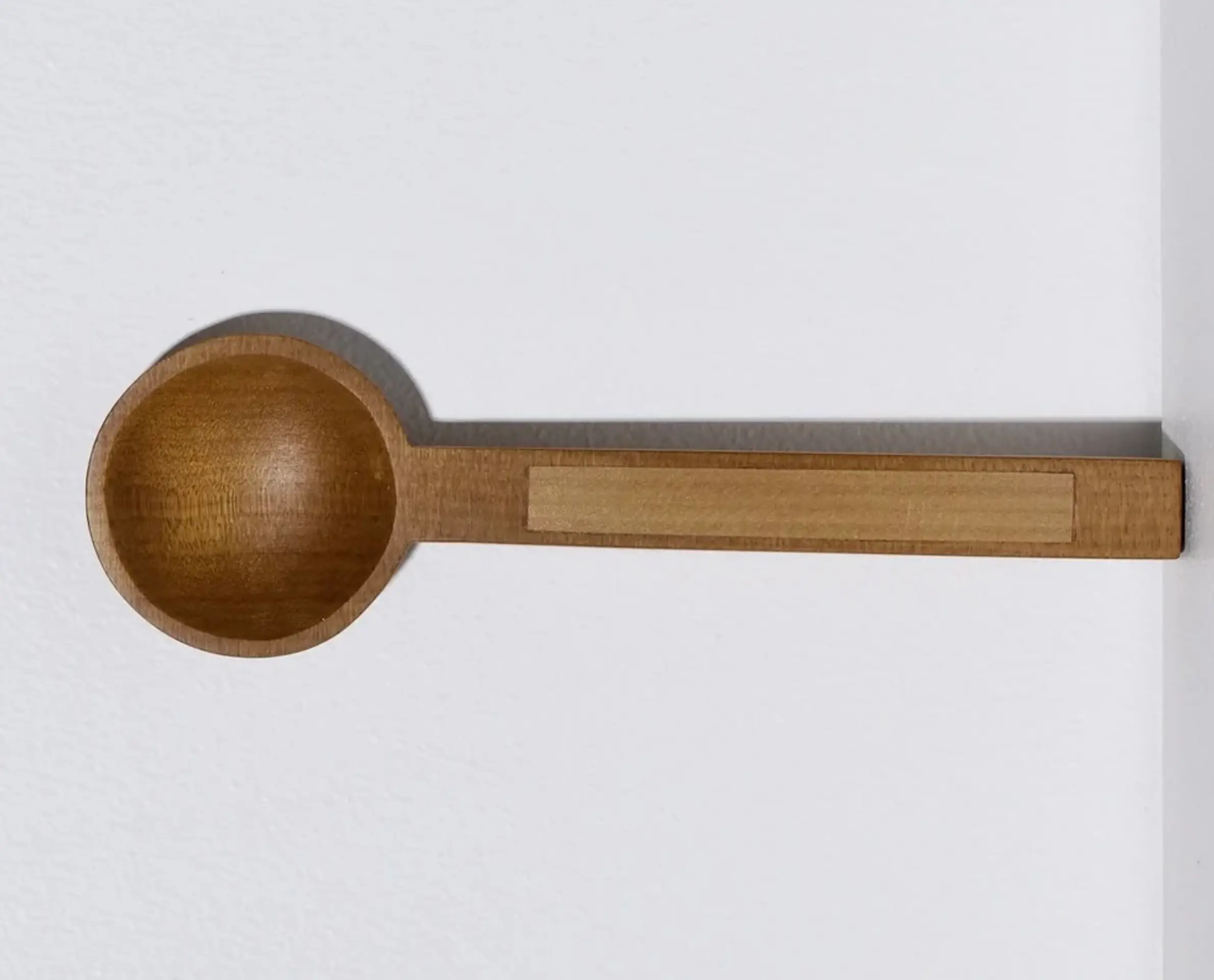 A hand carved inset spoon from Courtney Petleys 100 piece series hand made in Aotearoa, New Zealand