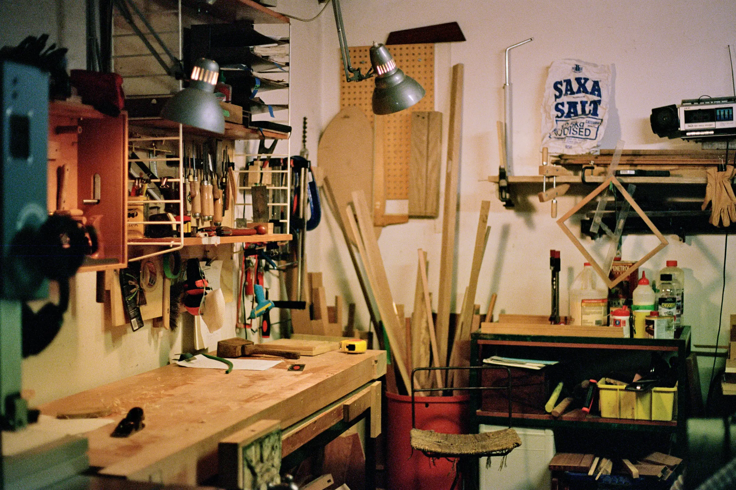 Josephines wood workshop with tools and wood and work benches around