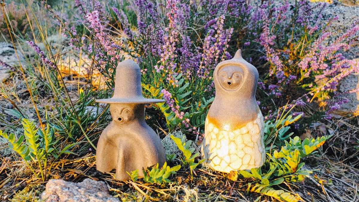 the set of CERES incense burners sitting on a bed of grass and flowers 