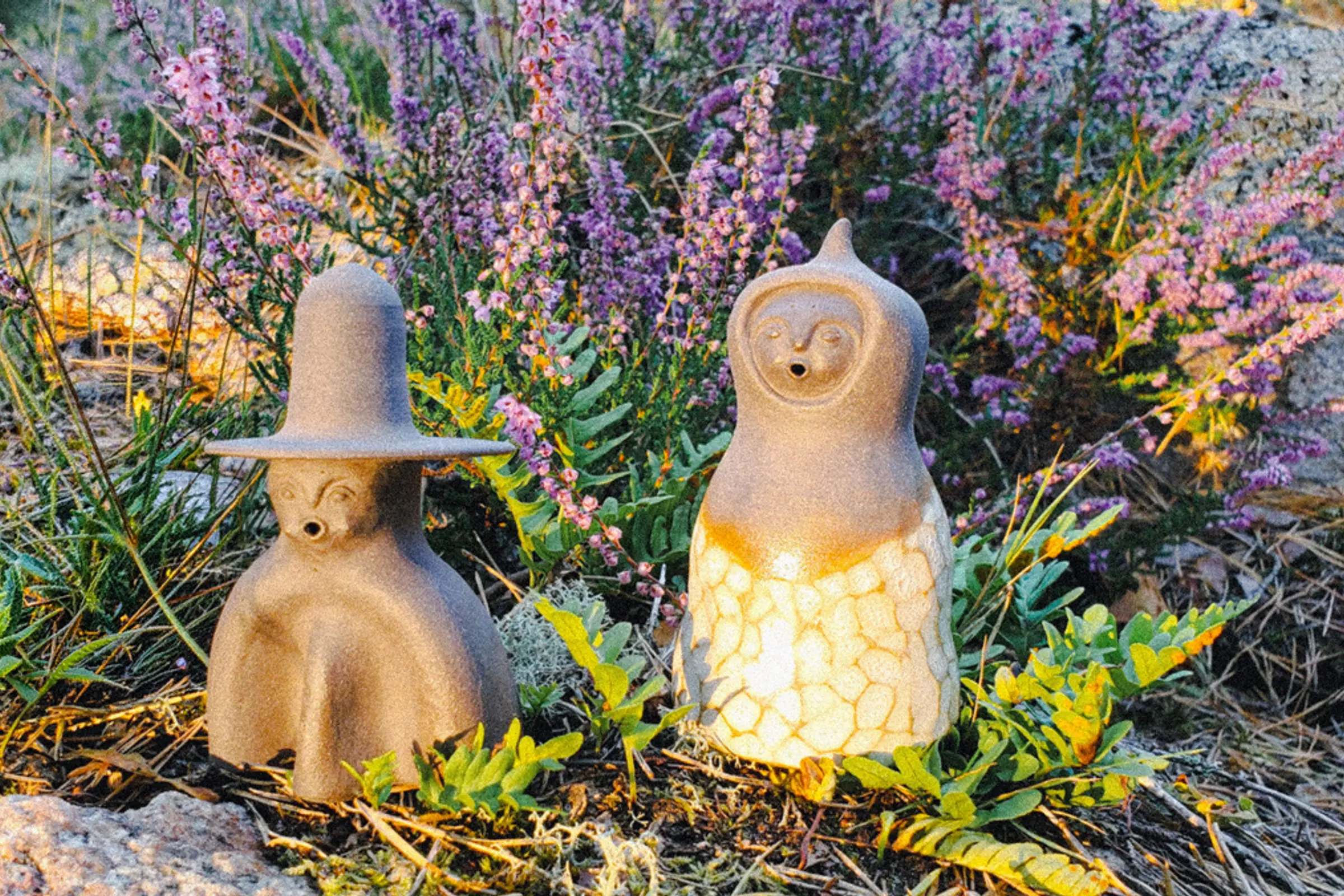 the set of CERES incense burners sitting on a bed of grass and flowers