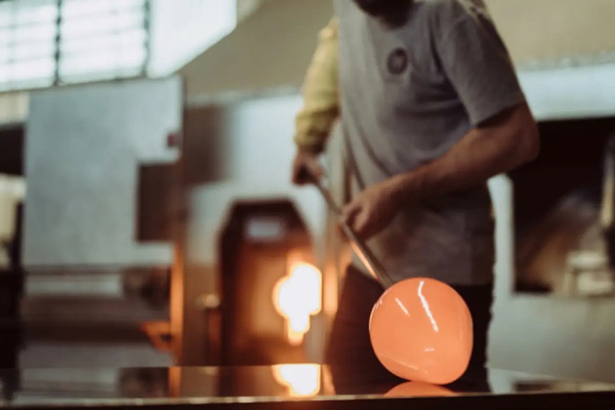 rolling hot glass in a studio