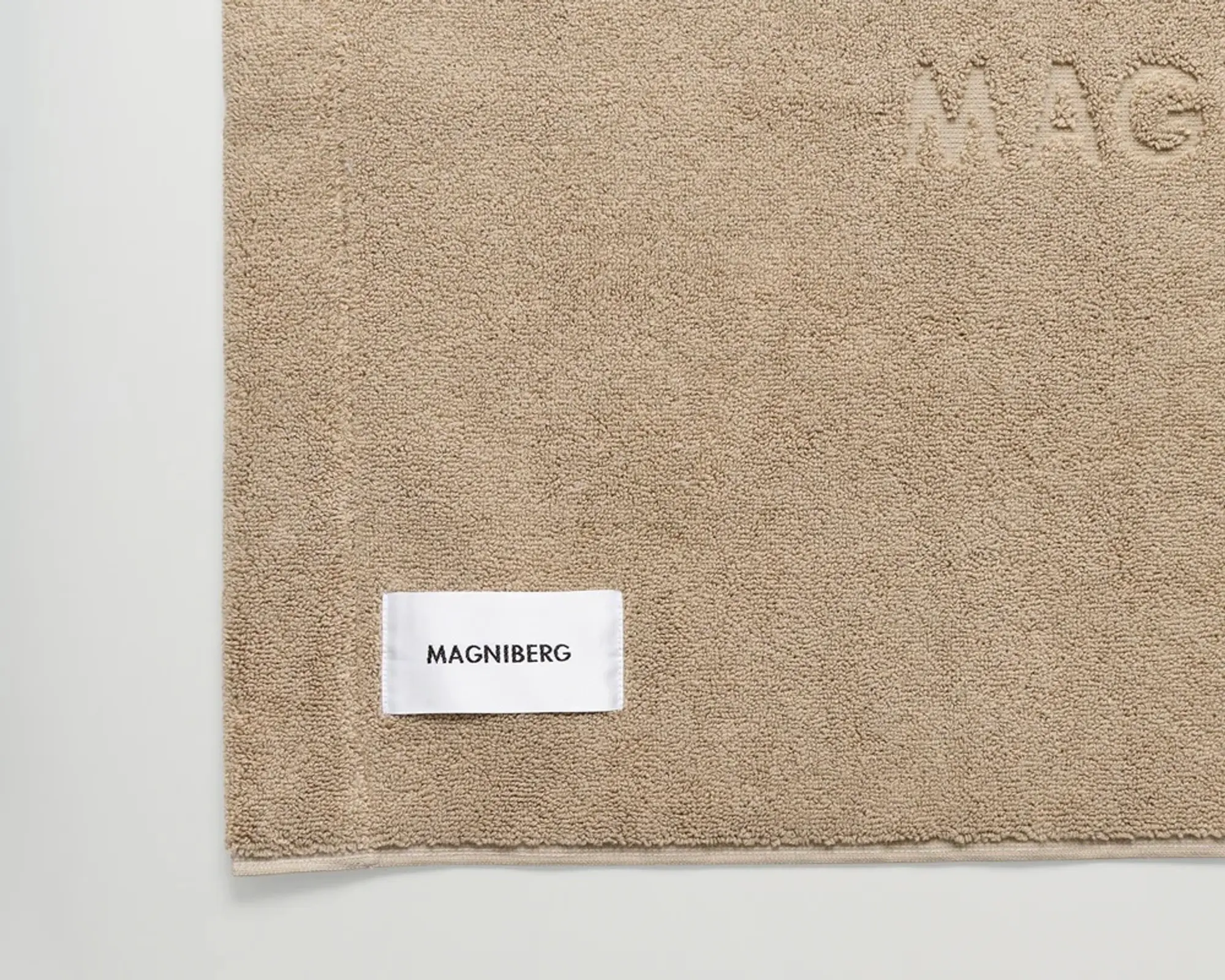 A close up of the Magniberg cone beige gelato bath mat in a heavy 950gsm weight