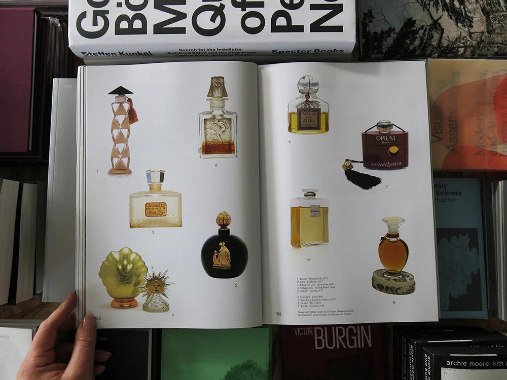 An image from inside of The Viscose 07: Scent book showing a collage of vintage perfume bottles
