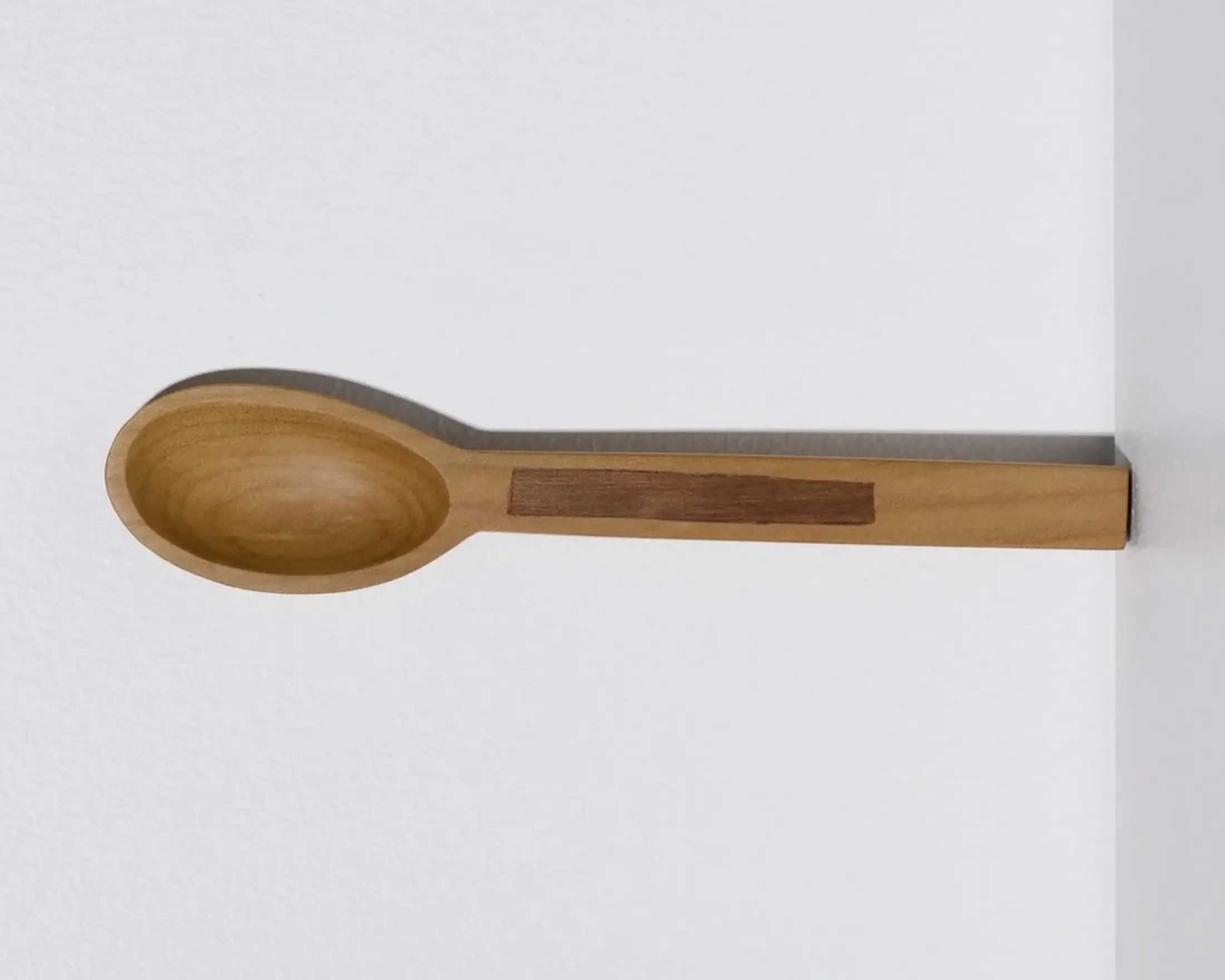 A hand carved inset spoon from Courtney Petleys 100 piece series hand made in Aotearoa, New Zealand