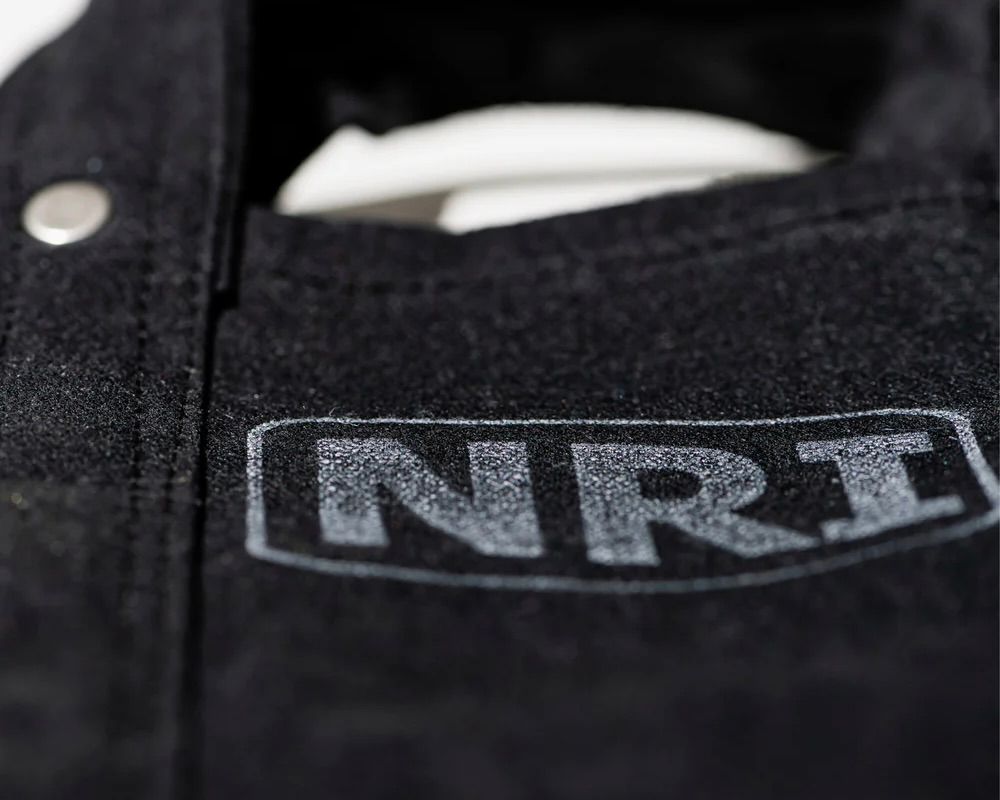 a close up of the labour tote bag in black canvas, 