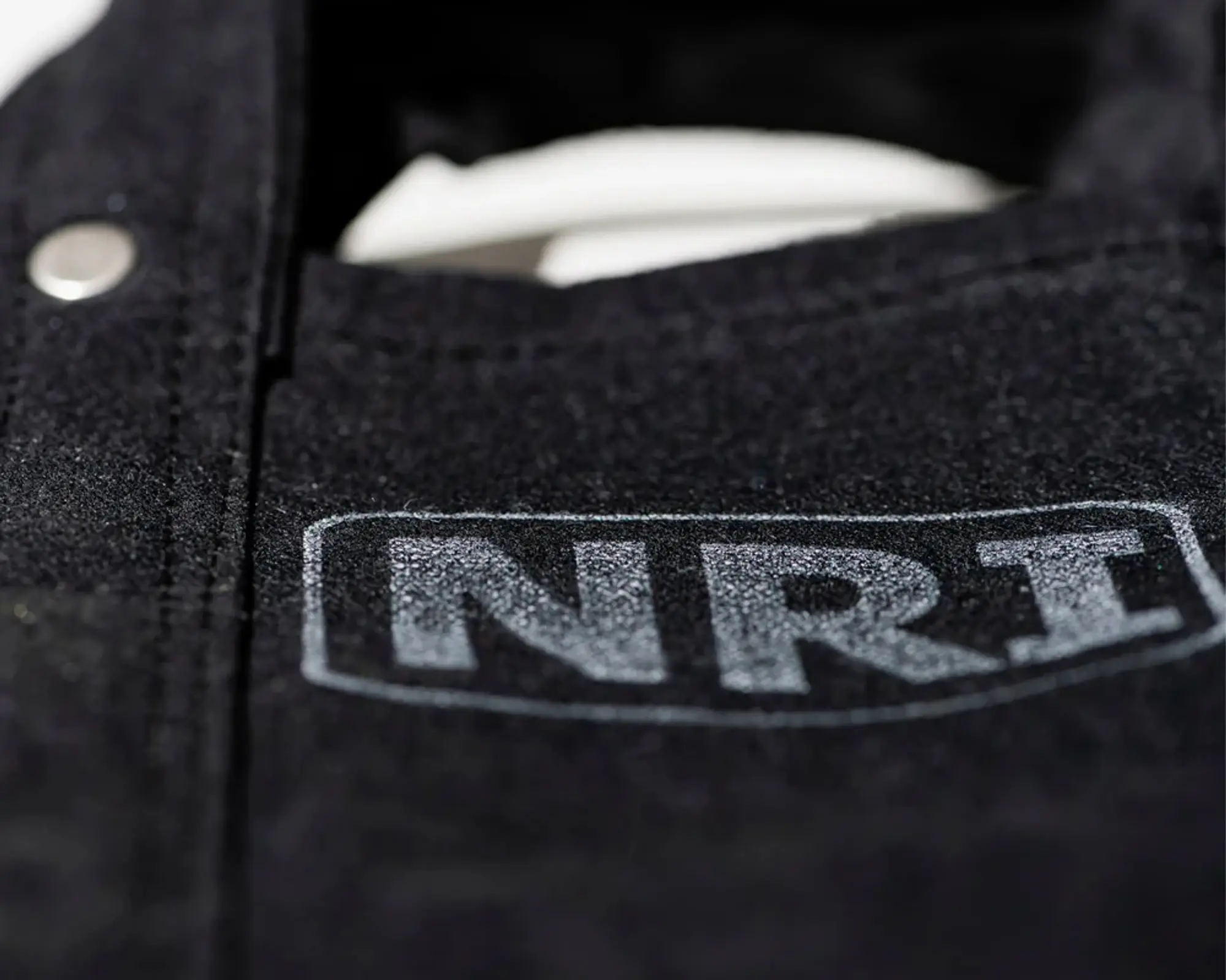 a close up of the labour tote bag in black canvas,