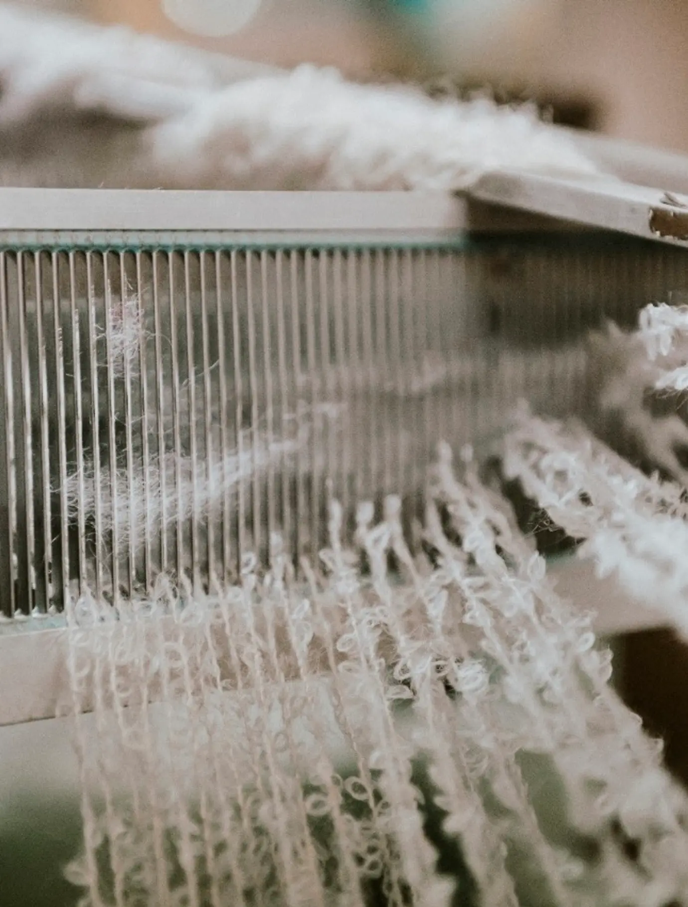 a process weaving photo of wool on a loom