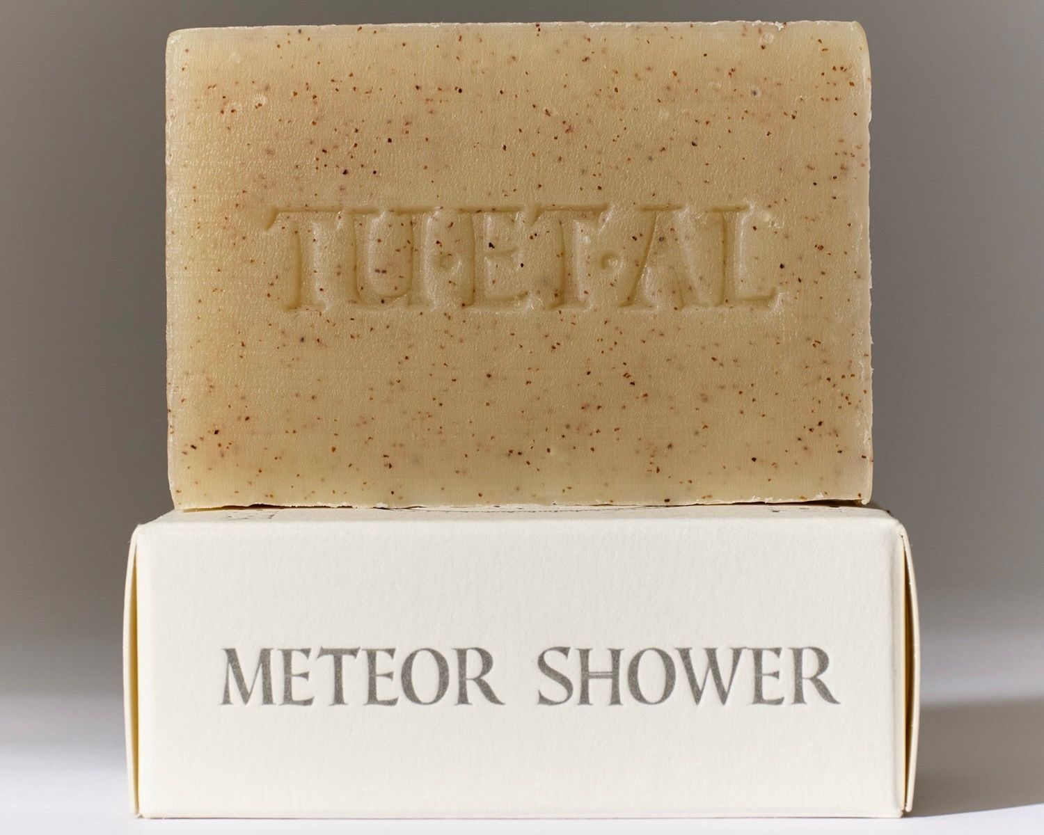 Tuétal Meteor Shower cold process bar soap handcrafted with finely ground apricot shells and botanical essential oils.