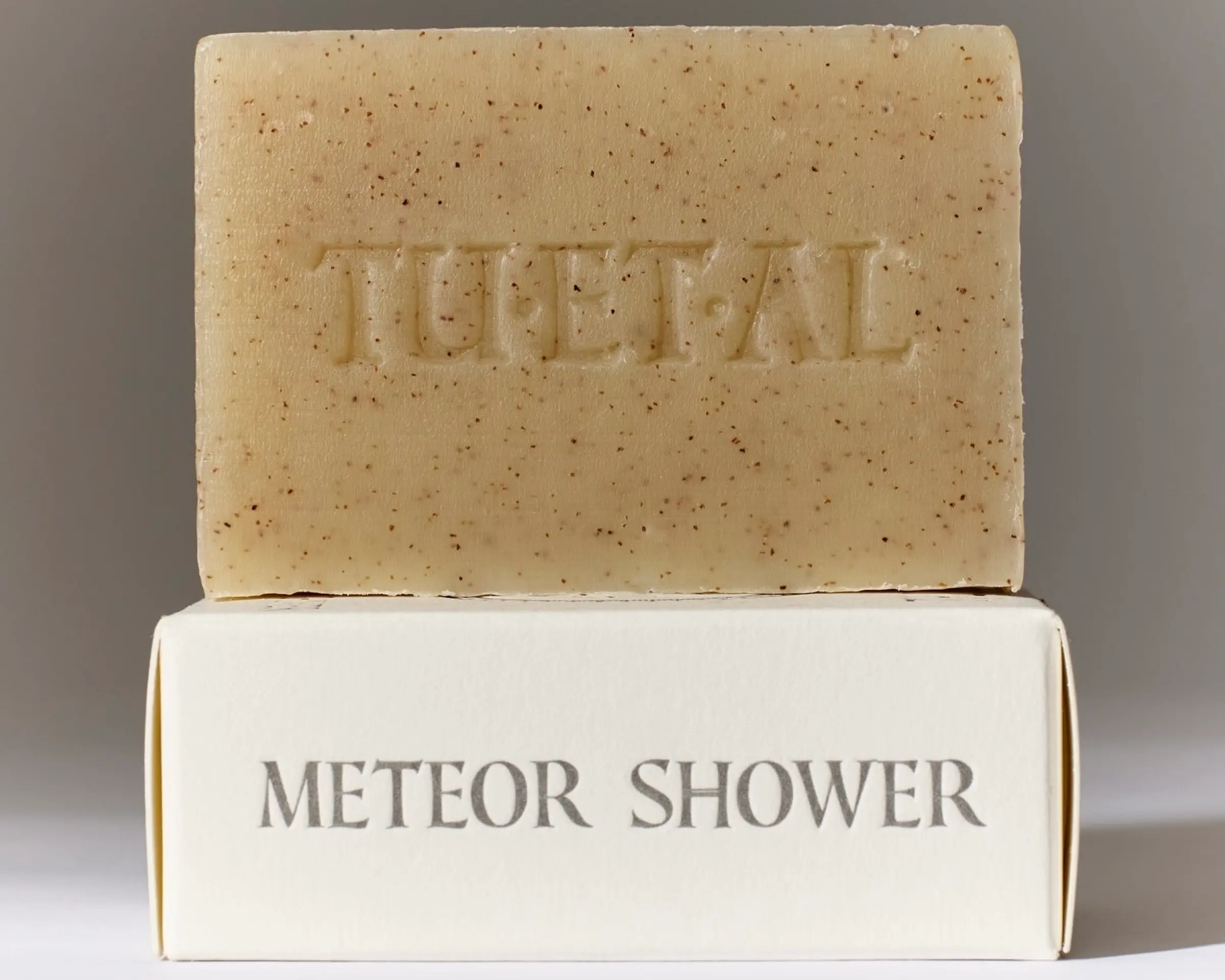 Tuétal Meteor Shower cold process bar soap handcrafted with finely ground apricot shells and botanical essential oils.