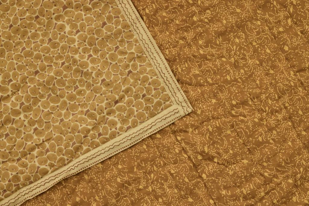 a close up of the attendant print from Studio fords quilt, mustard and gold tones