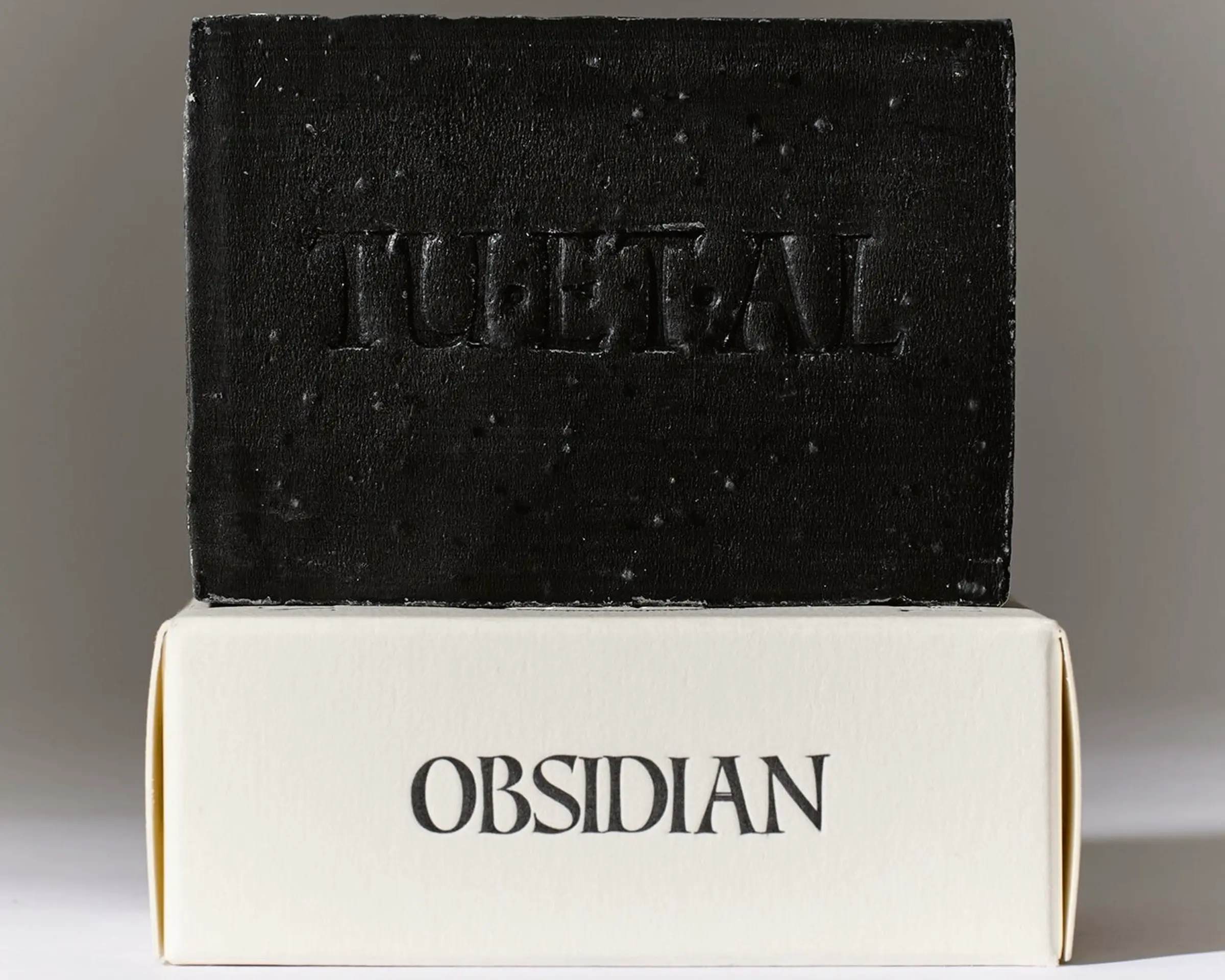 Tuétal Obsidian cold process bar soap handcrafted with activated coconut charcoal and botanical essential oils.