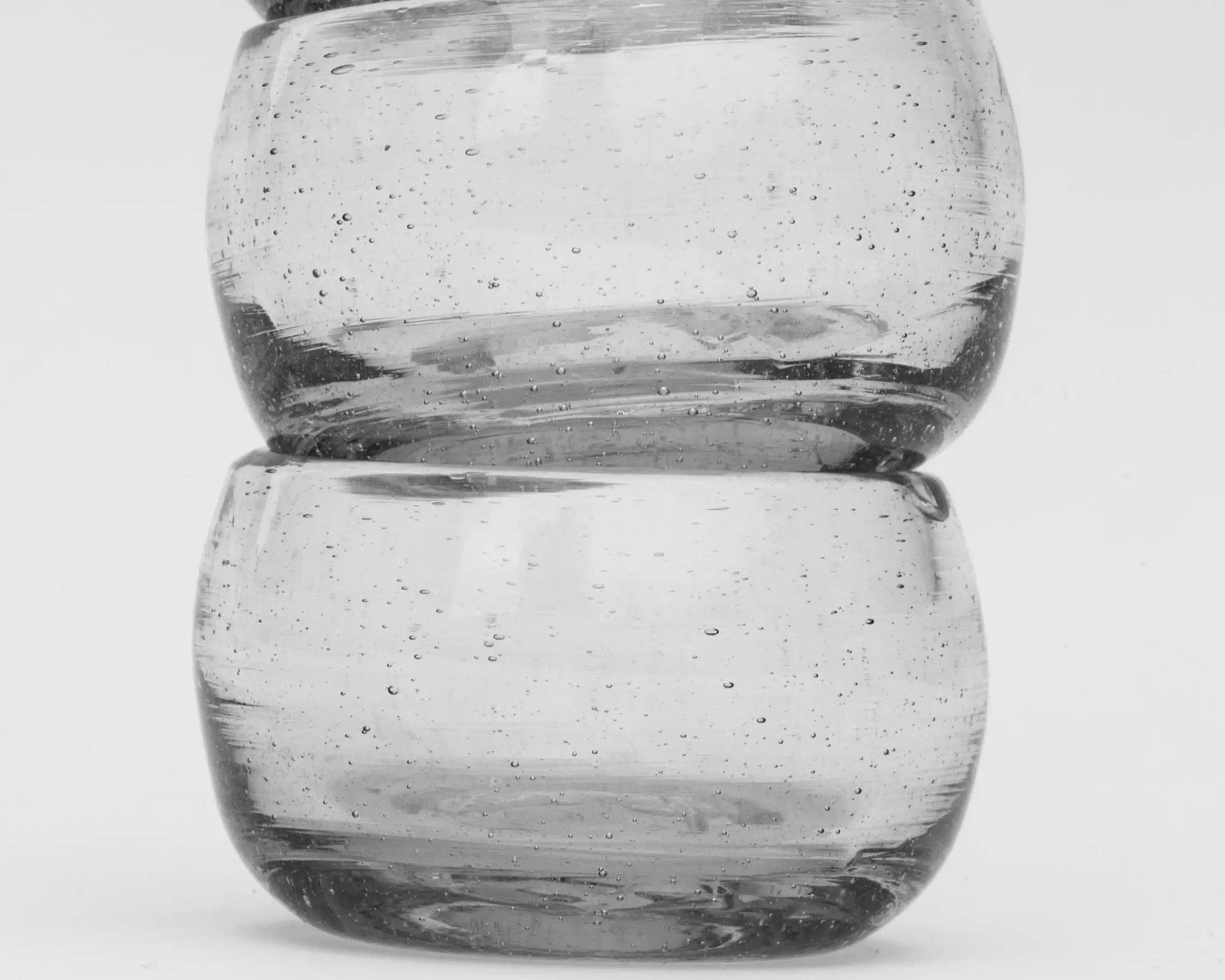 Three clear glasses stacked onto of each other