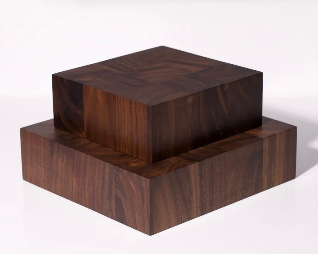 Two of Courtney Petleys end grain chopping boards stacked ontop of each other, both in a deep rich tone of Walnut, hand made in Auckland, New Zealand