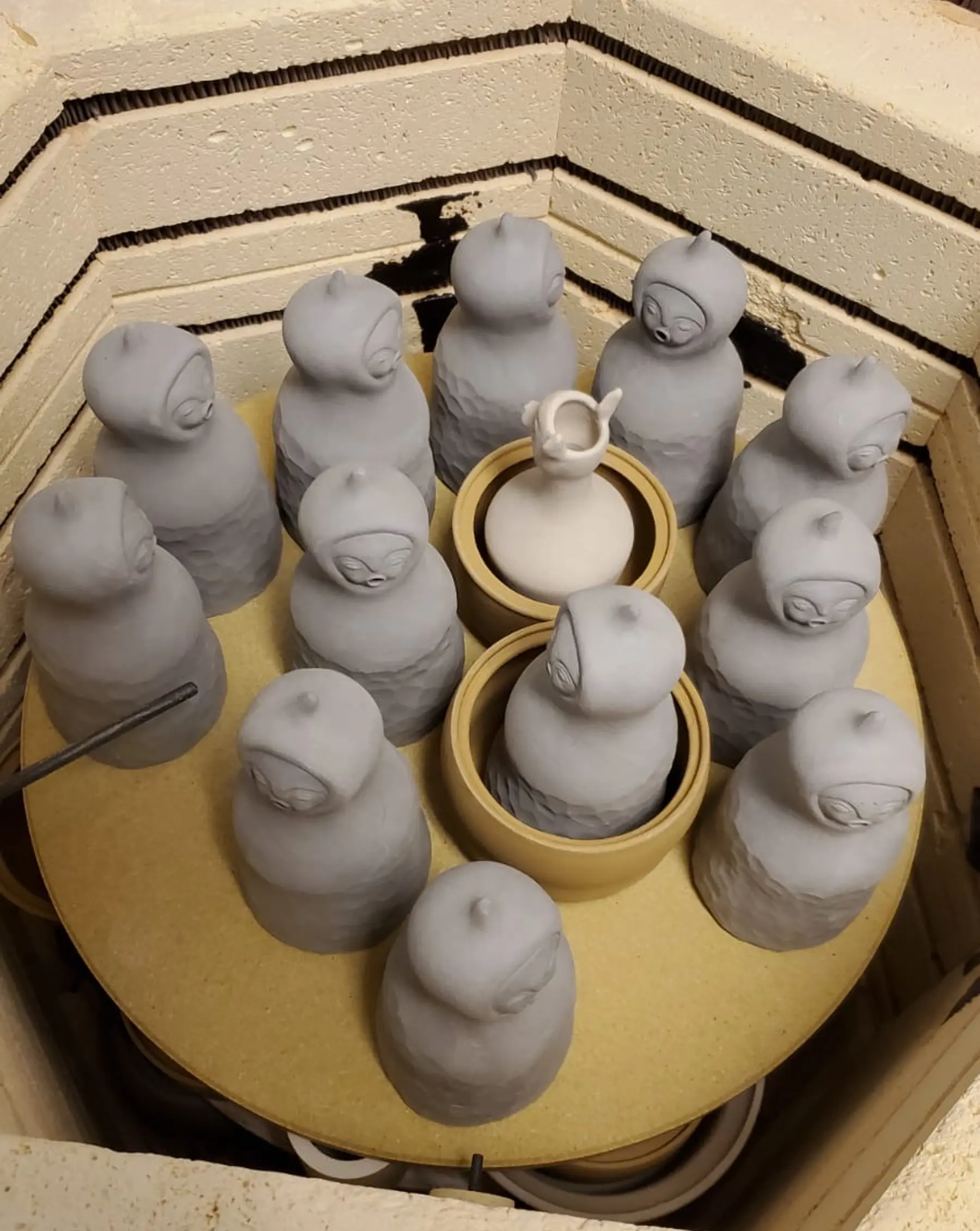 a kiln full of CEREs incense burner figurines