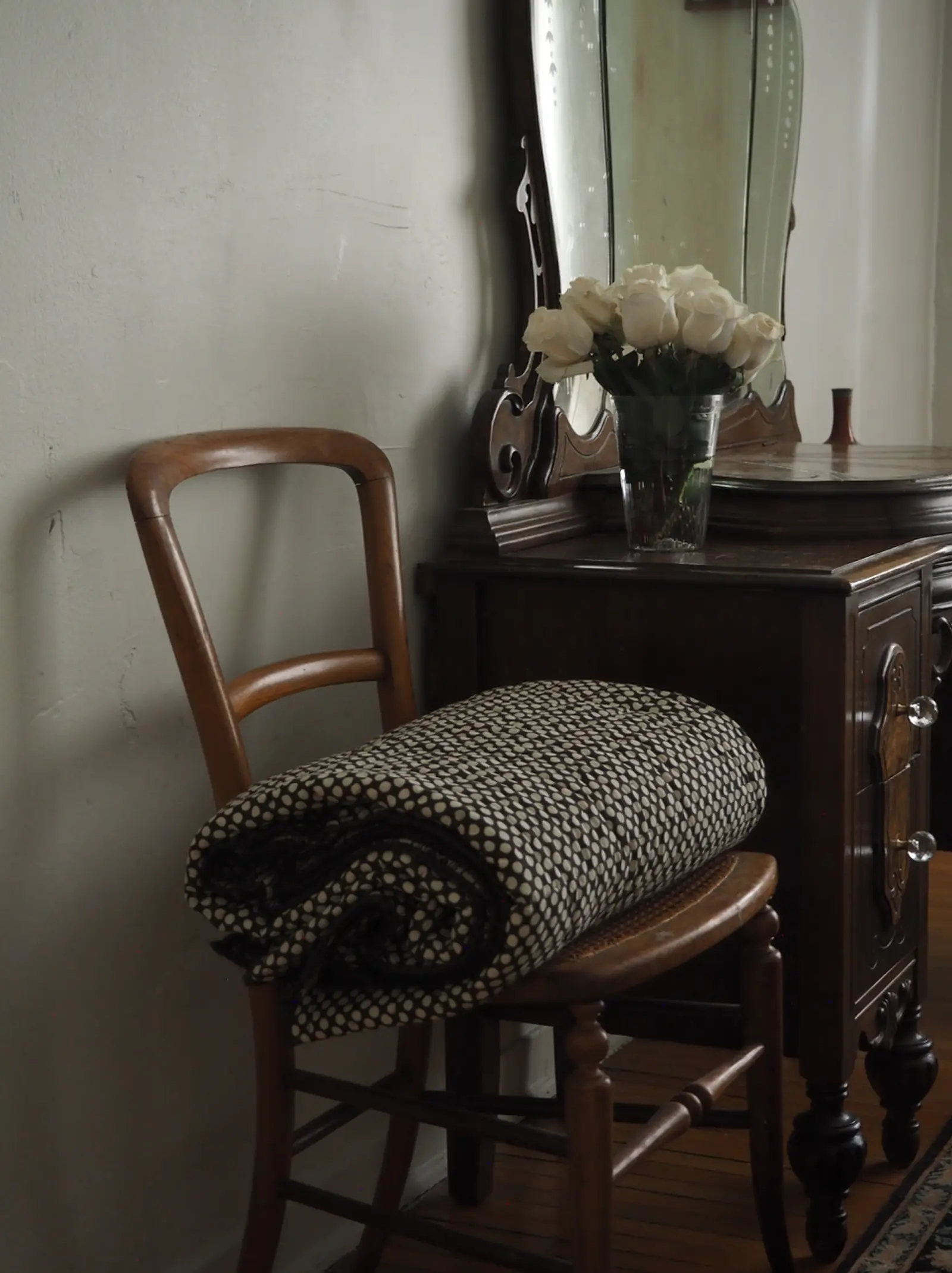 Studio Ford Vesuvius Block Printed Cotton Quilt on a chair in a bedroom setting