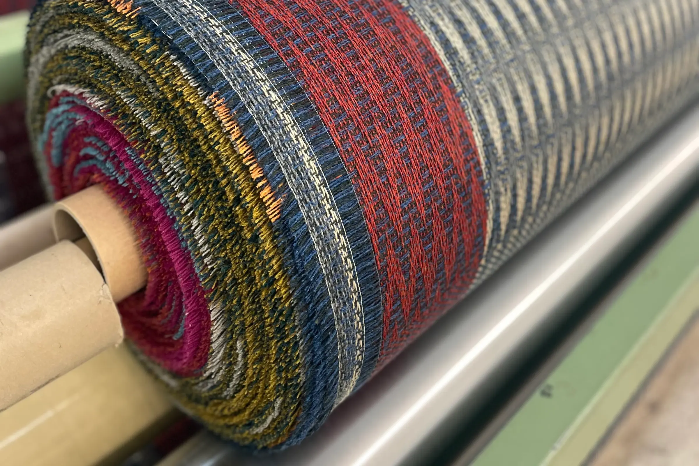 woven fabric roll on a loom