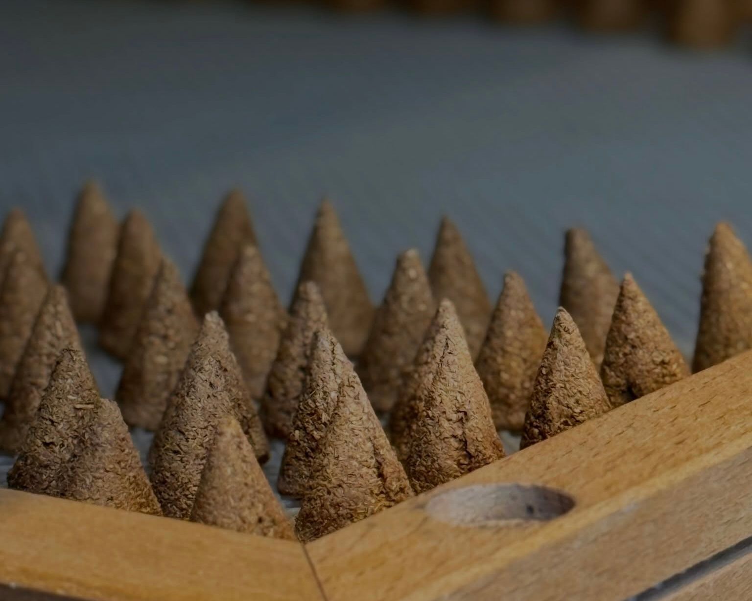incausa discovery incense cones on a drying rack
