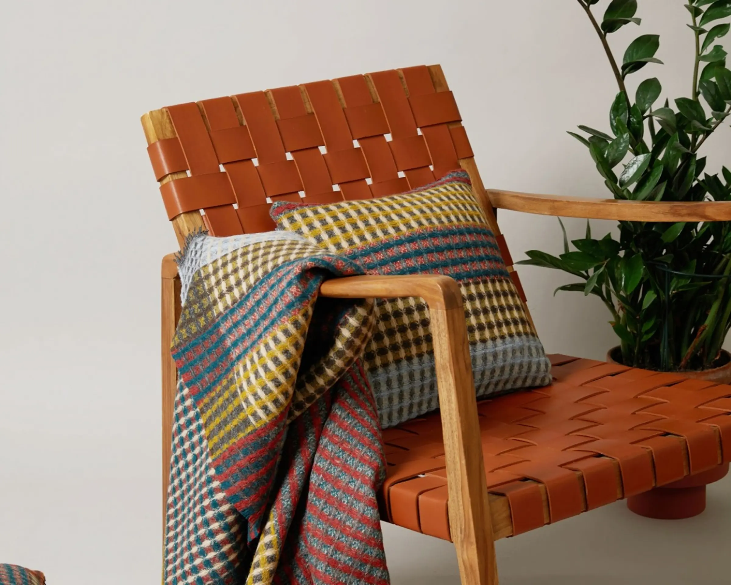 a wool cushion and throw on a chair
