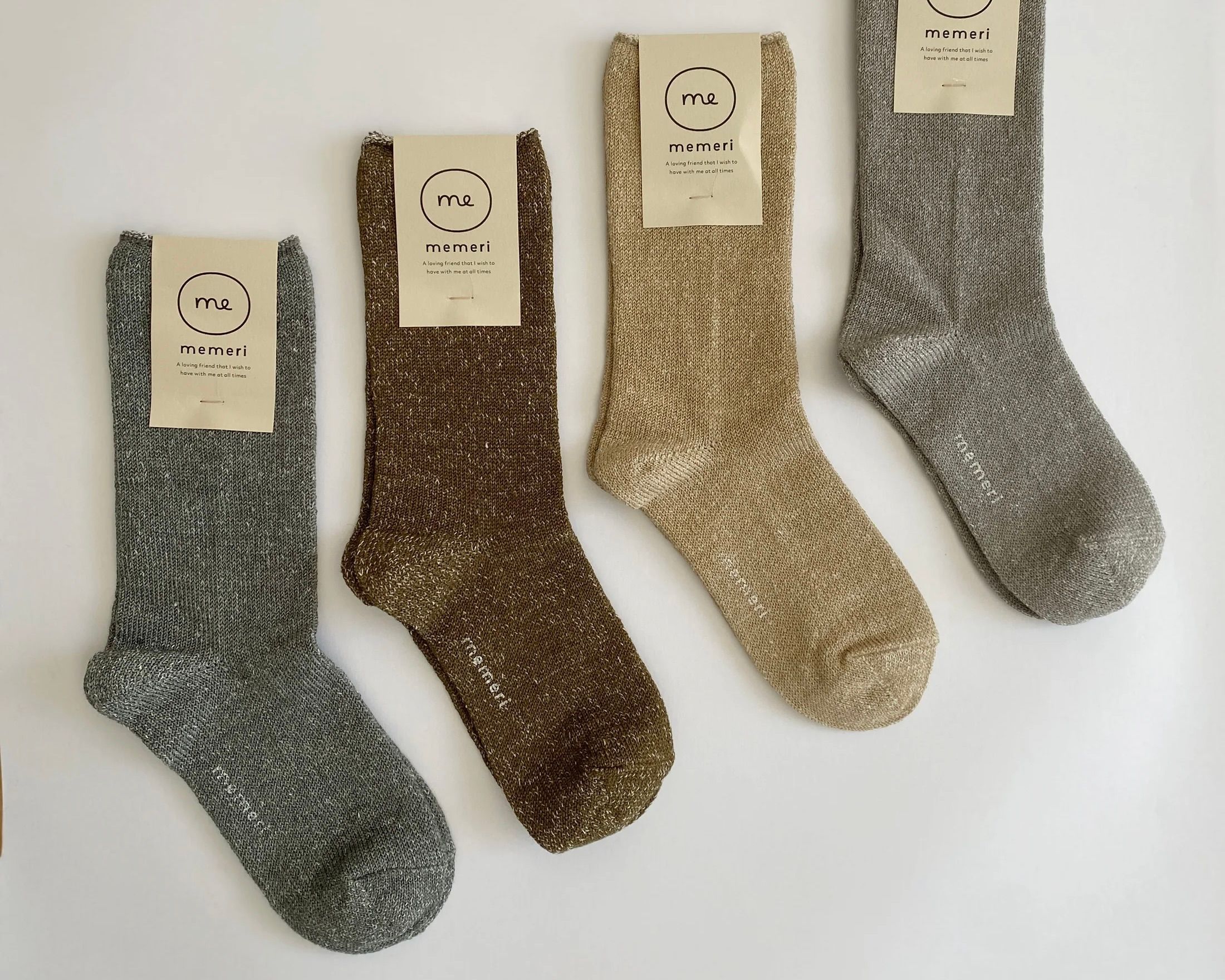 a collection of linen and silk socks in neutral colours from Memeri Japan