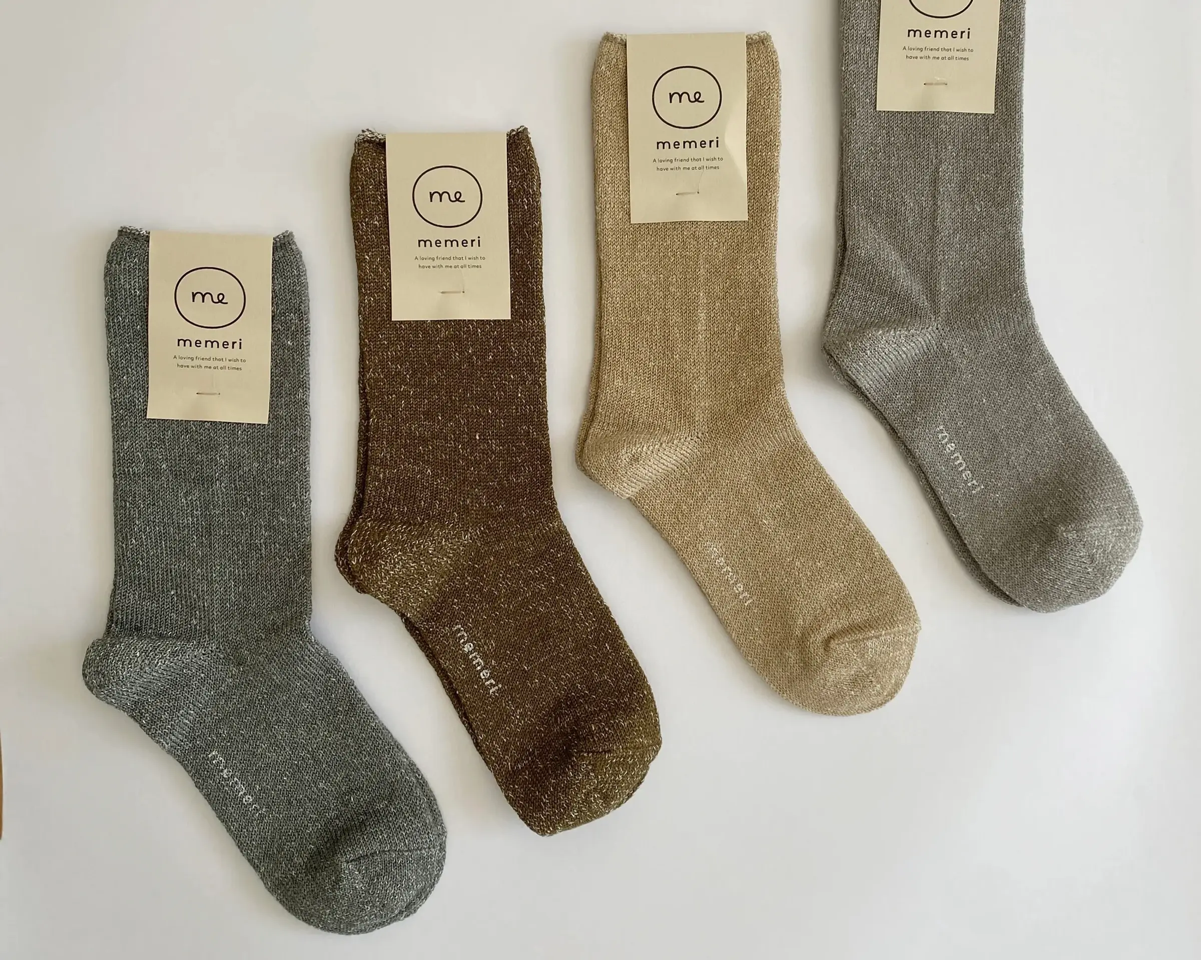 a collection of linen and silk socks in neutral colours from Memeri Japan