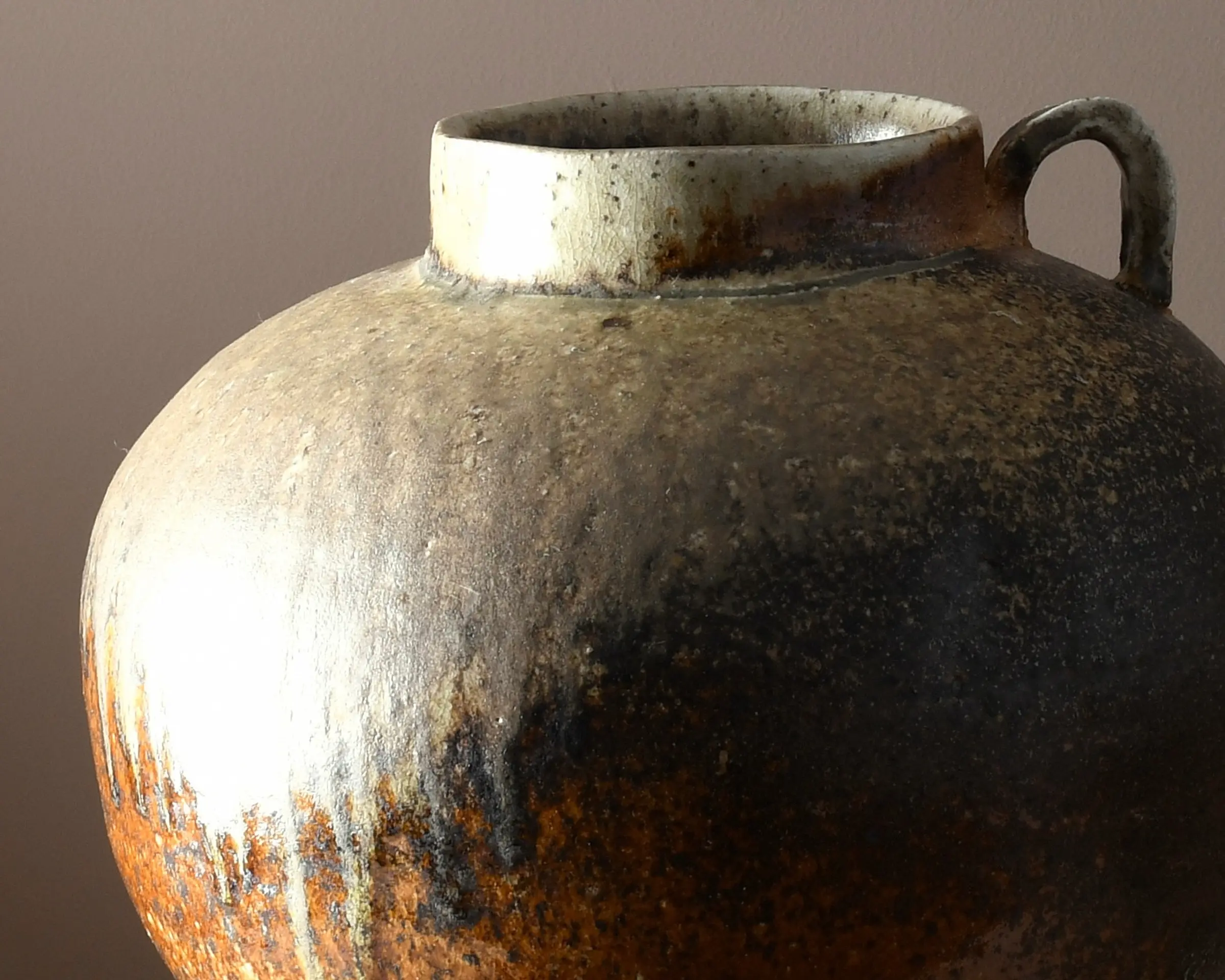 A one-of-a-kind stoneware vase by Aotearoa ceramic artist Holly Rose Morgan, wood-fired in the historic anagama kiln at Kamaka Pottery, Bridge Pā, with champagne-toned ash and the movement of flame forming its distinctive surface.