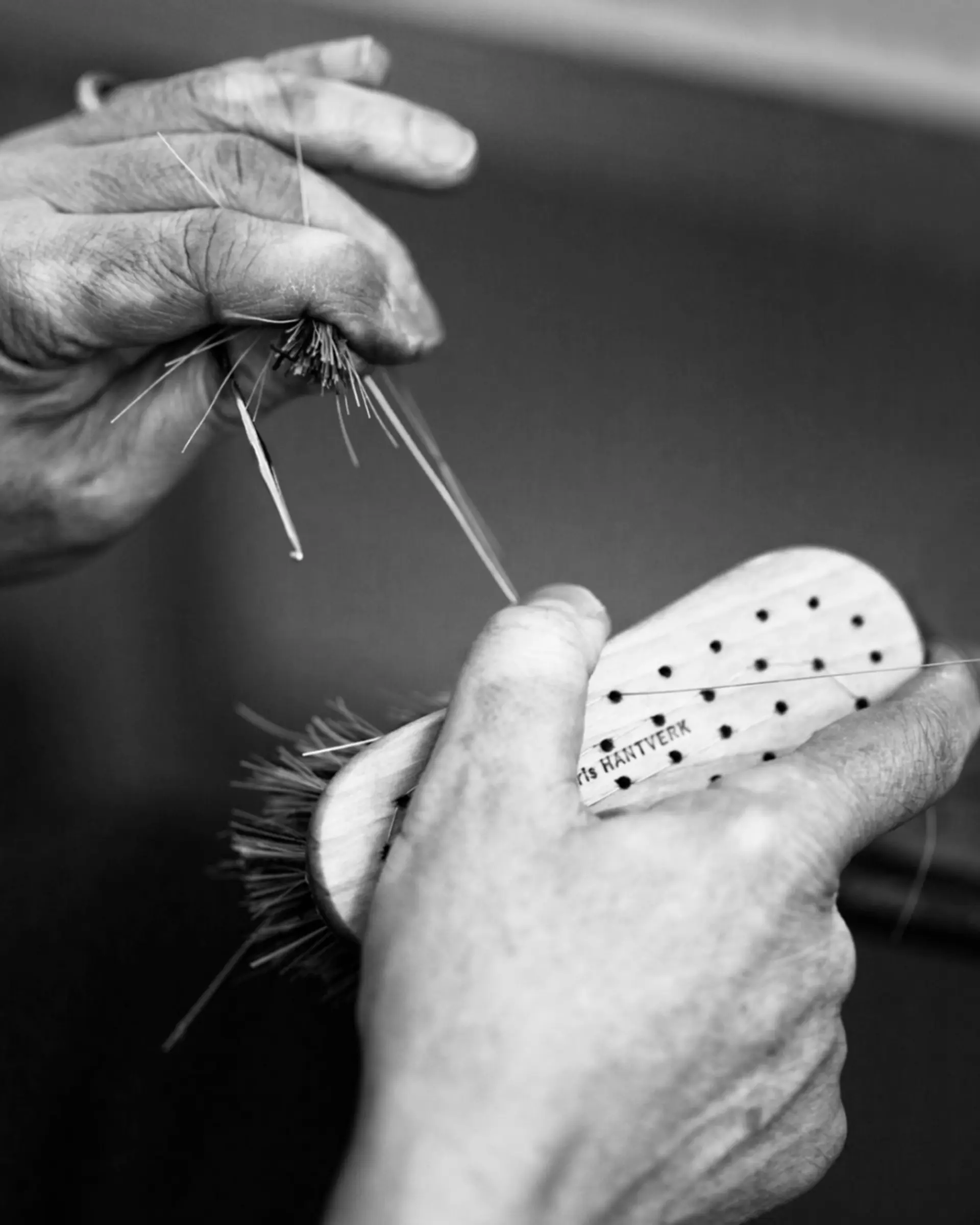 a workers hand brush binding
