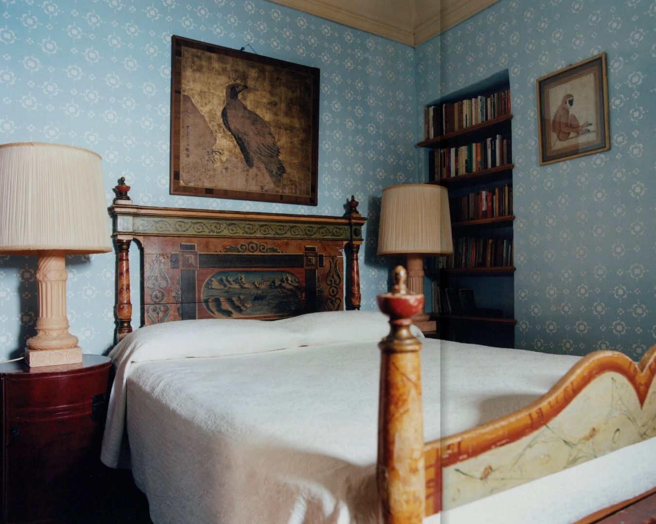 photo of a bedroom with pale blue wall papered walls