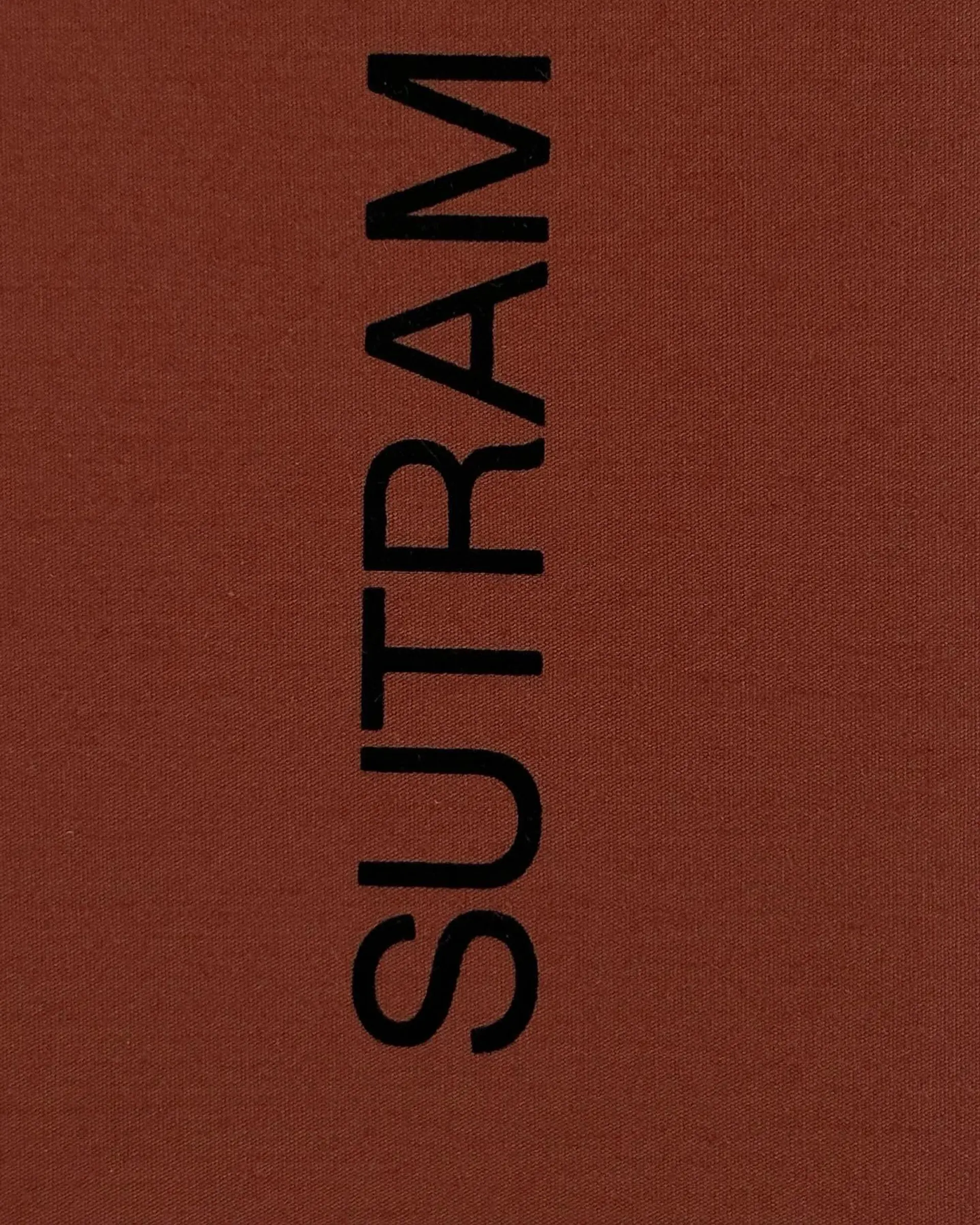 Sutram Logo in Maroon and Black