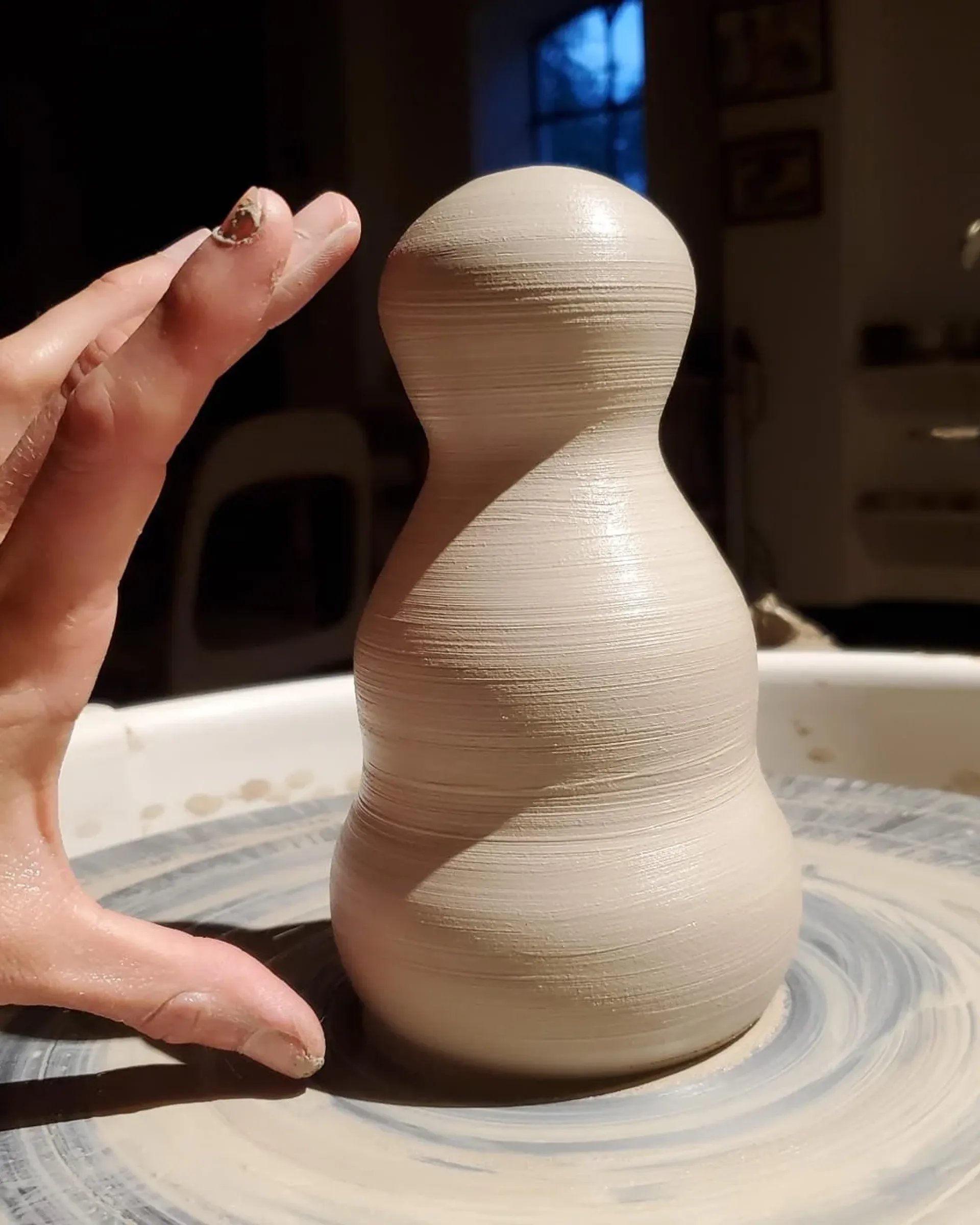 Clay on a pottery wheel forming the figure of Ceres no.1