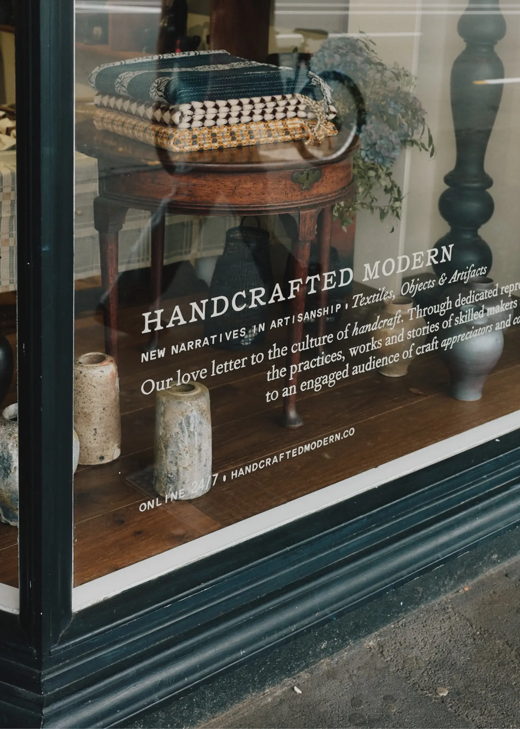Hand-painted storefront lettering at Handcrafted Modern in Ponsonby, Auckland, inviting visitors into our contemporary craft and design store.