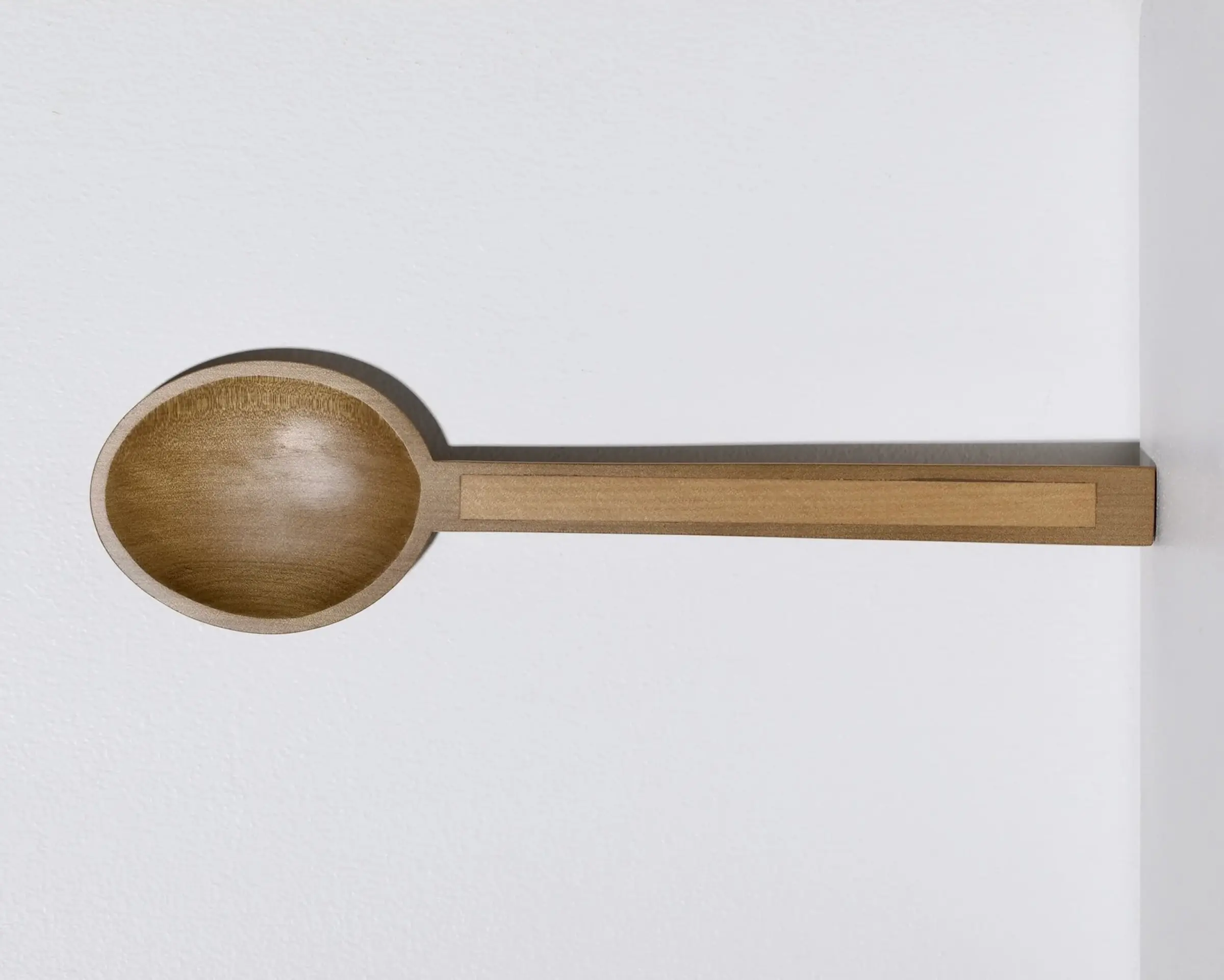 A hand carved inset spoon from Courtney Petleys 100 piece series hand made in Aotearoa, New Zealand