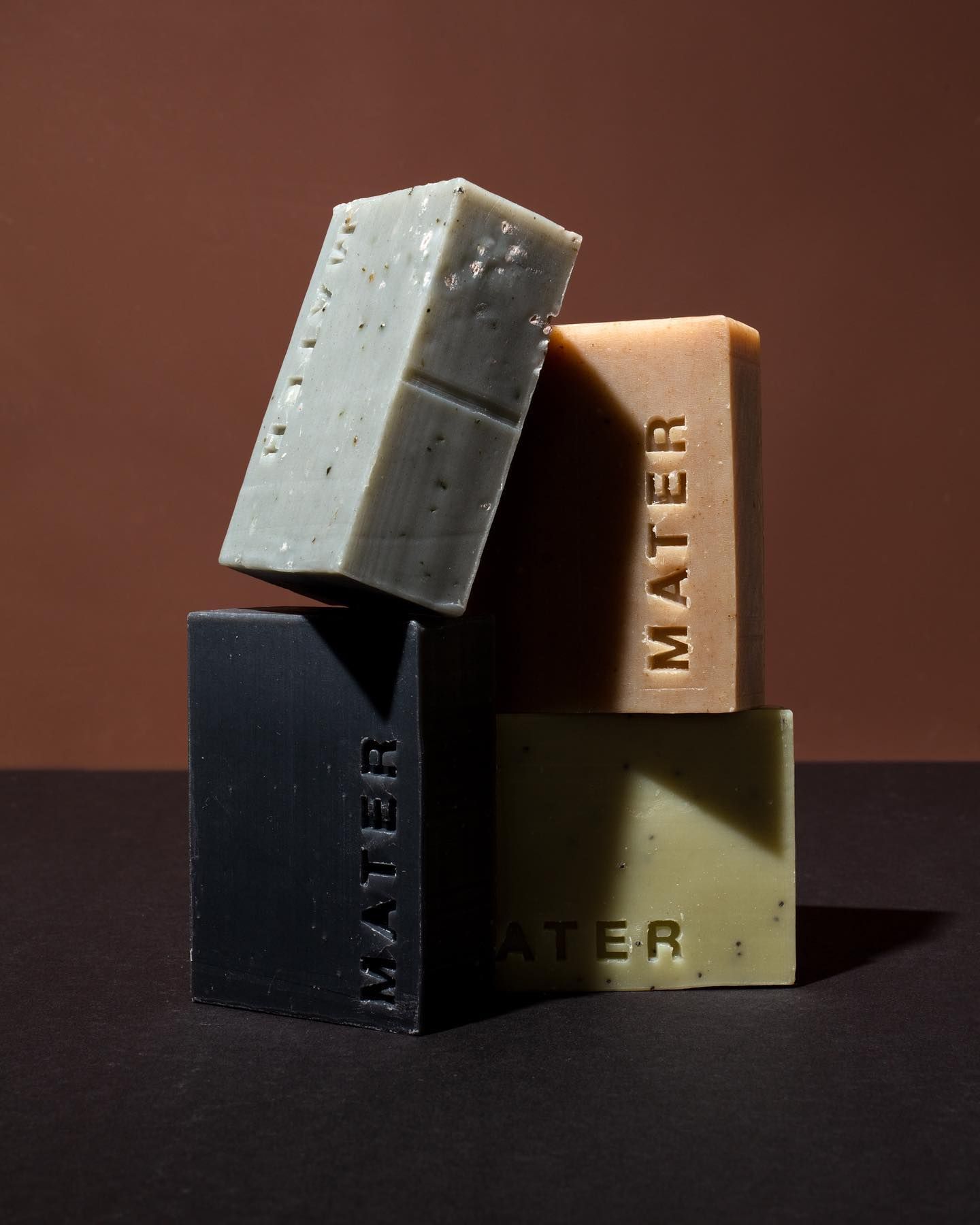 Mater stacked bar soap studio shot on a brown background 