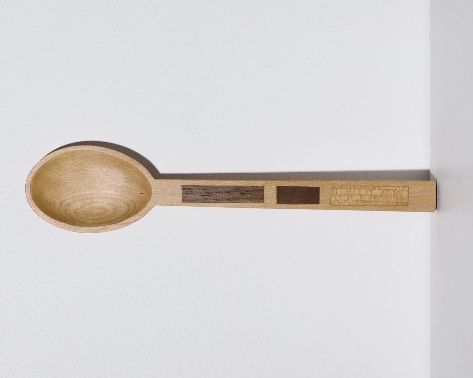 A hand carved inset spoon from Courtney Petleys 100 piece series hand made in Aotearoa, New Zealand