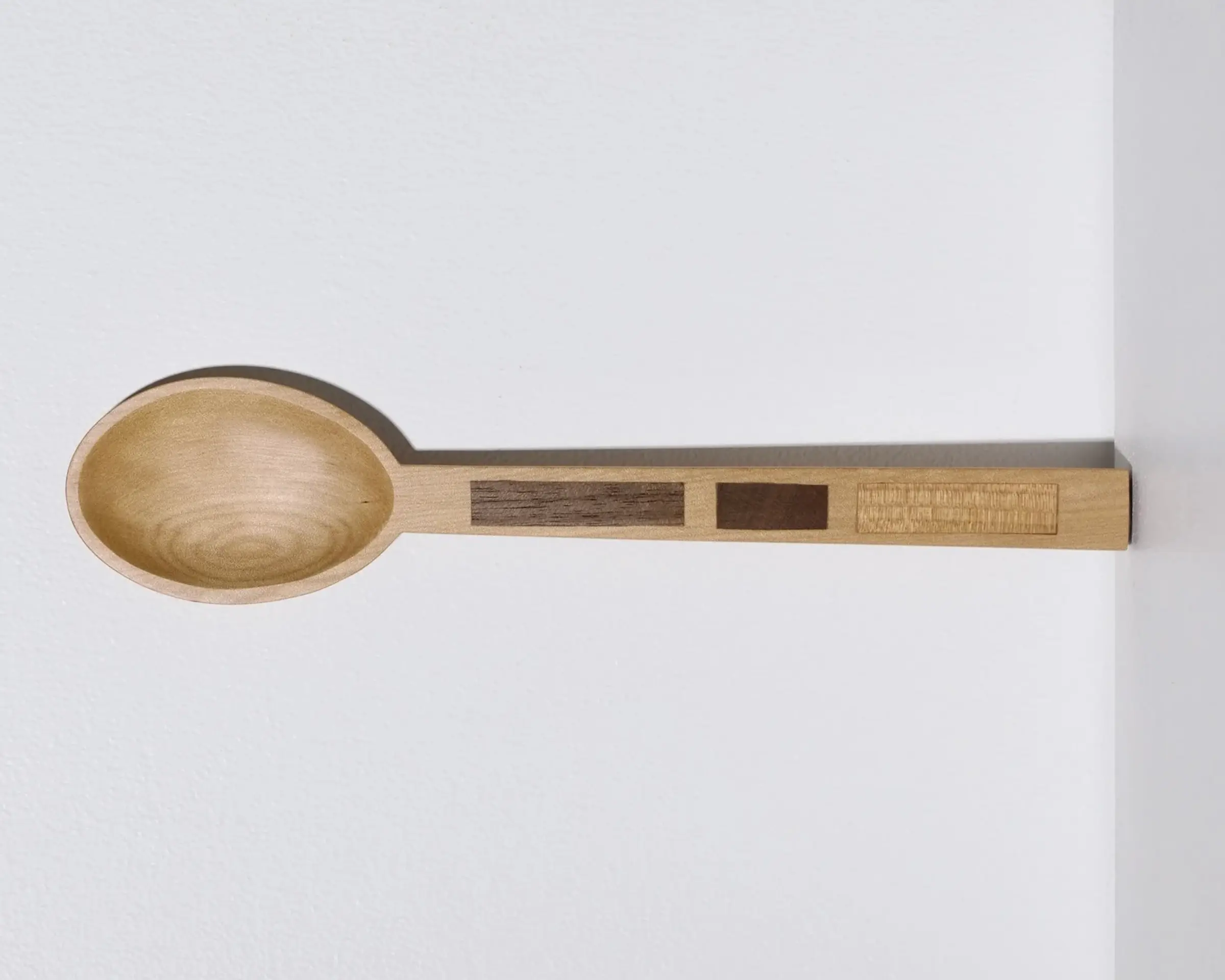 A hand carved inset spoon from Courtney Petleys 100 piece series hand made in Aotearoa, New Zealand