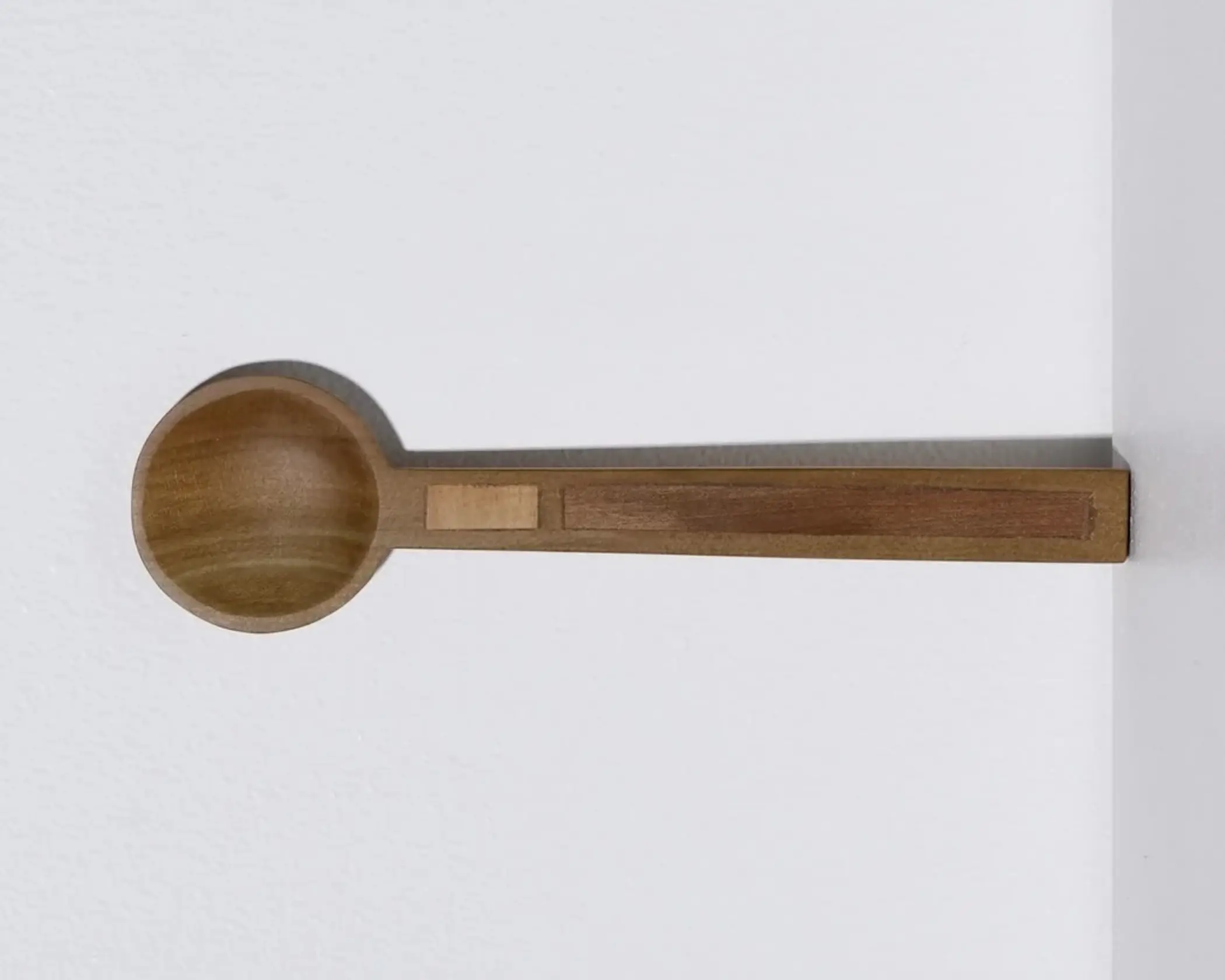 A hand carved inset spoon from Courtney Petleys 100 piece series hand made in Aotearoa, New Zealand