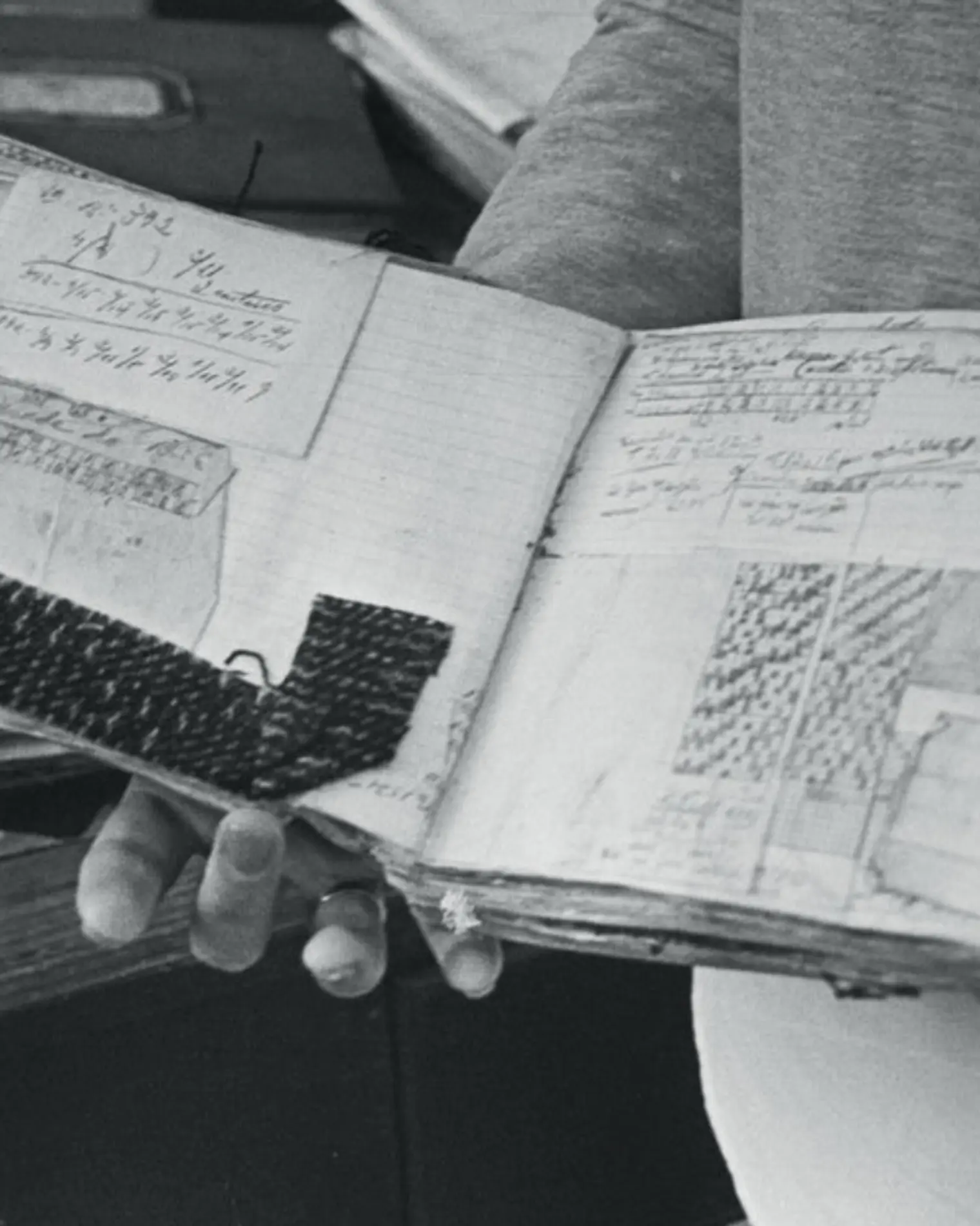 blanket designs are planned on grid paper and translated into woven samples