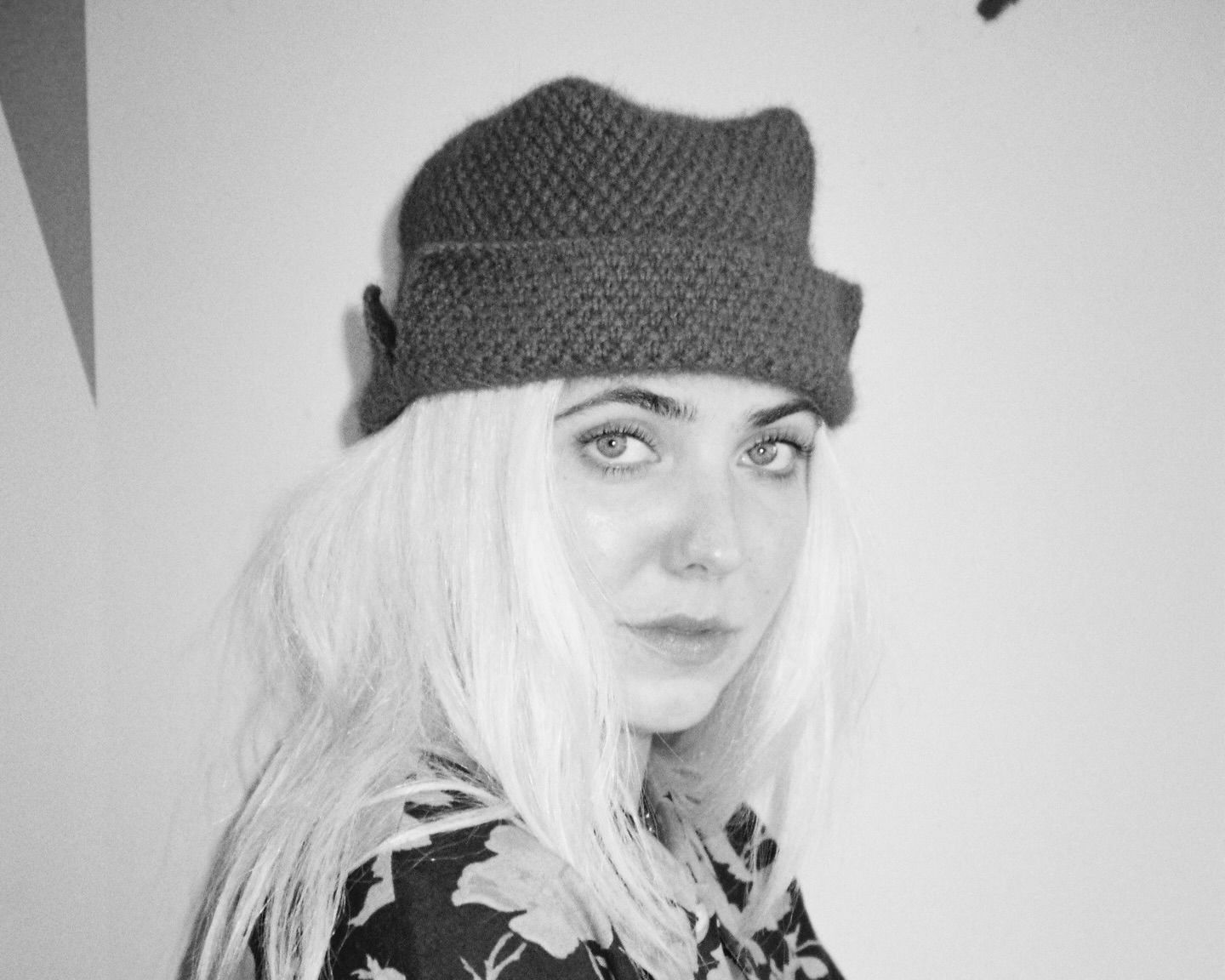 Bonnie Wore Ted Hat in possum merino worn by a woman, hand knitted in New Zealand.
