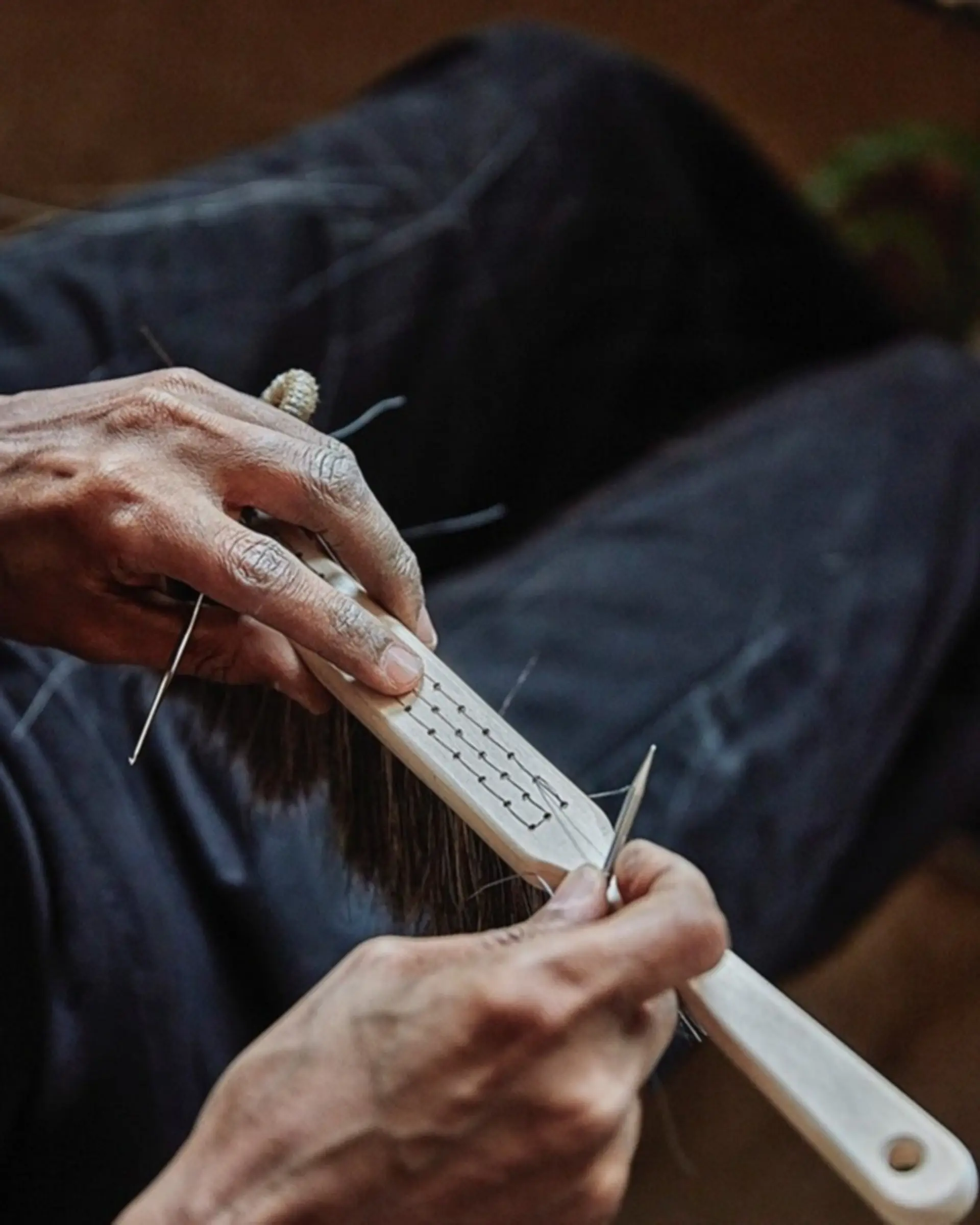a brush binder threading wire to hold the brush together