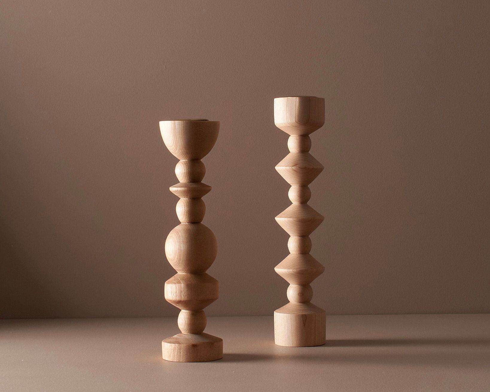 Elise mclauchlan wooden tapered medium and tall candle holders on a moody brown background