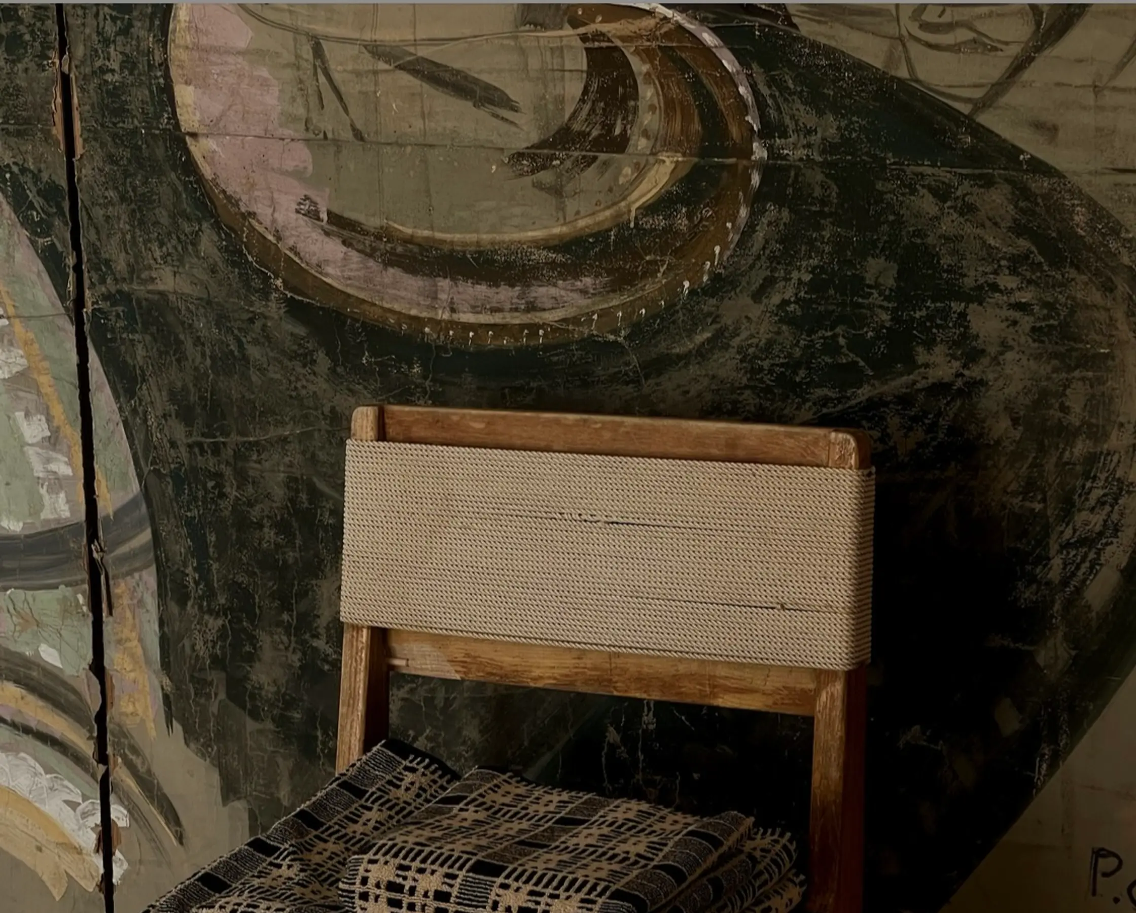 Alma towels folded on a vintage chair