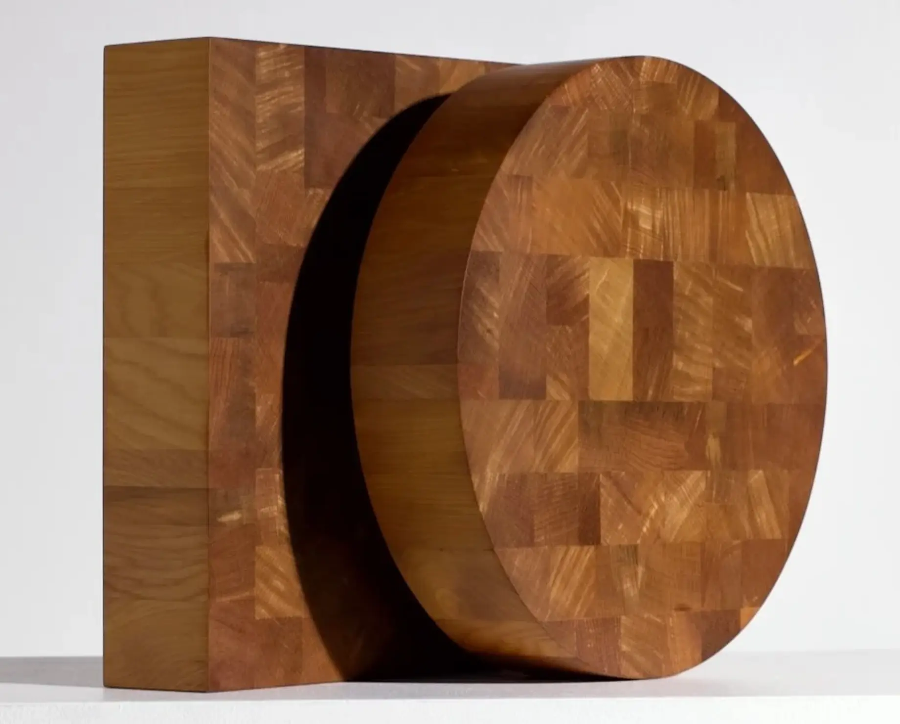 A pair of Courtney Petleys round and square end grain chopping boards made from Swamp Kauri in Auckland New Zealand