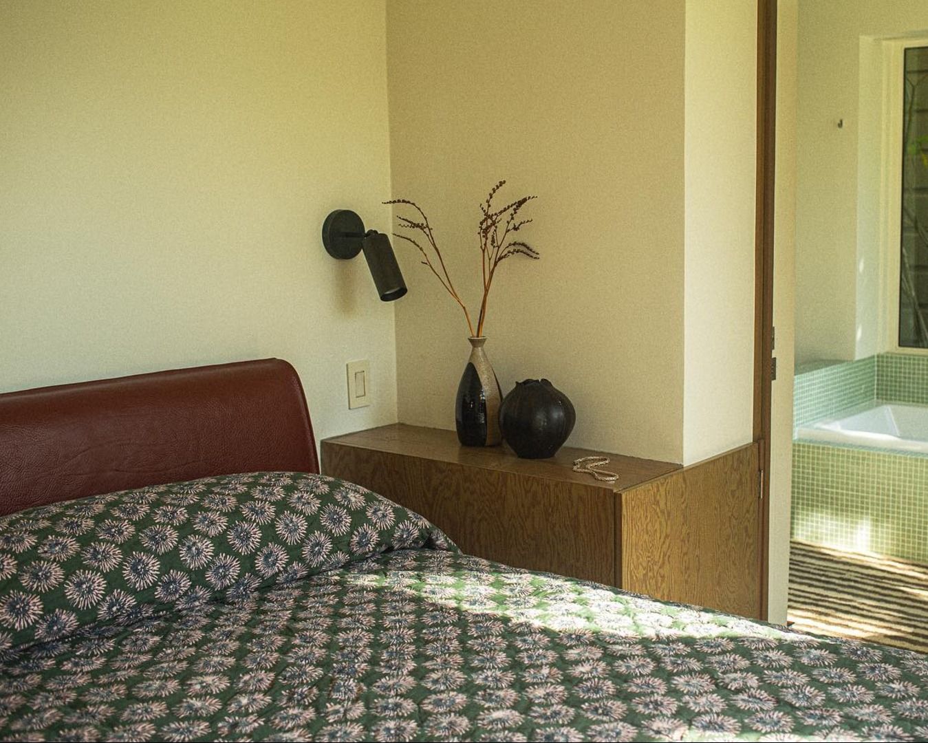 studio fords blooming flower quilt in a bedroom setting