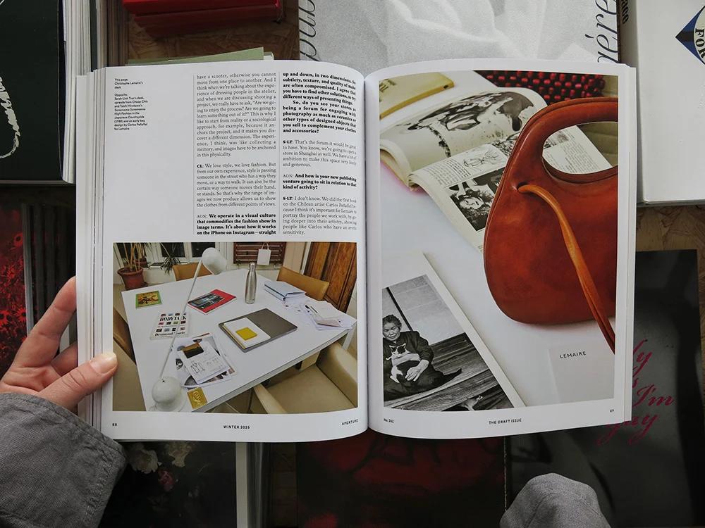 Aperture No. 261: The Craft Issue open to an interior spread featuring photography, books and a sculptural leather bag.