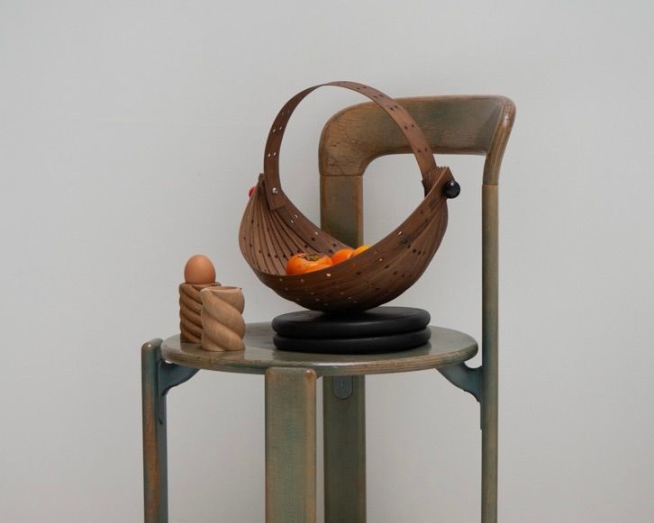 OROS Zarucolander on a chair with the tornado add cups next to it